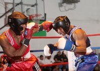 Air Force welterweights Daniel Logan, left, and James Beck, right, compete during the Air Force Box-off tournament at the Bennett Fitness Center Jan. 22. (U.S. Air Force photo/Robbin Cresswell)
