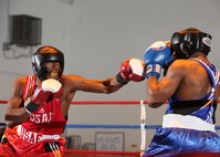Air Force welterweights Daniel Logan, left, and James Beck, right, compete during the Air Force Box-off tournament at the Bennett Fitness Center Jan. 22. (U.S. Air Force photo/Robbin Cresswell)