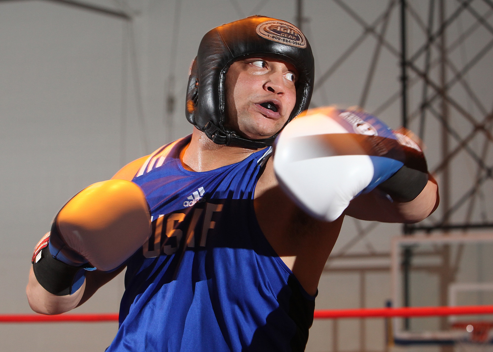 Air Force heavyweight Kent Brinson throws a punch during his bout at the Bennett Fitness Center Jan. 22. Brinson won his fight with Owaldo Escamilla by earning a unanimous decision from the judges. (U.S. Air Force photo/Robbin Cresswell)