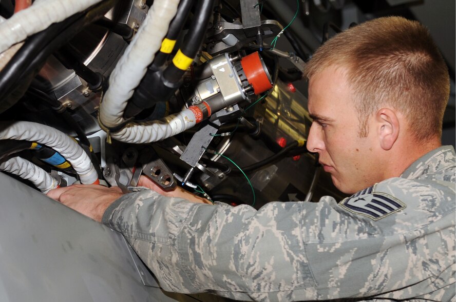 Staff Sgt. Andrew Boone, 2nd Munitions Squadron launcher maintenance team chief, performs a Conventional Air Launched Cruise Missile download from a launcher on Barksdale Air Force Base, La., Jan. 26. When Airmen from the 2 MUNS deploy, they provide required weapons and personnel when directed by headquarters. (U.S. Air Force photo/Senior Airman Brittany Y. Bateman)(RELEASED)