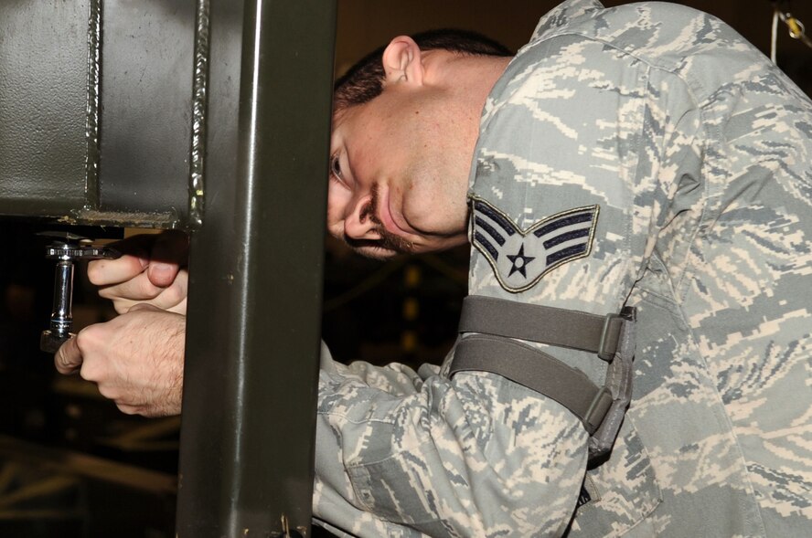 Senior Airman Bryan Hylton, 2nd Munitions Squadron performs a Conventional Air Launched Cruise Missile download from a launcher on Barksdale Air Force Base, La., Jan. 26. The mission of the 2 MUNS is to provide fully-mission capable cruise missiles and bombs whenever called upon. (U.S. Air Force photo/Senior Airman Brittany Y. Bateman)(RELEASED)