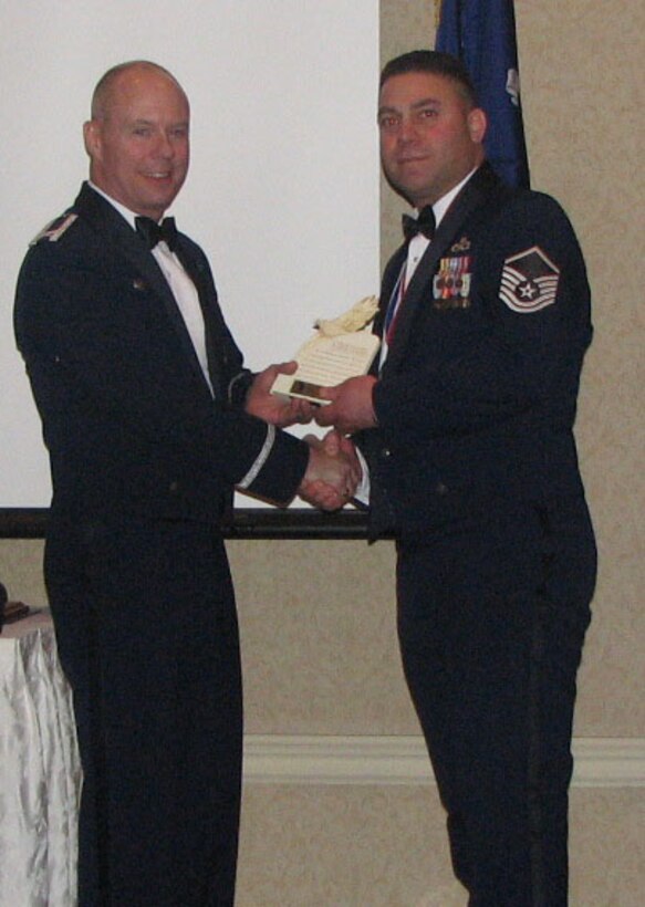 Master Sgt. Raam David received the Outstanding Senior NCO Award from EADS commander, Col. John Bartholf, at the annual awards banquet held on Jan. 21. 