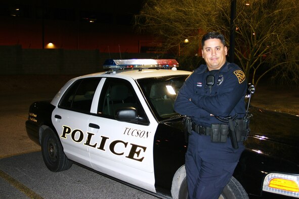 DAVIS-MONTHAN AIR FORCE BASE, Ariz. - Tucson Police Department Officer, Marcos Amado, not only serves his city, but his country as well. One weekend a month and two weeks a year he goes by Tech. Sgt. Amado and serves as a Reservist at the 943rd Rescue Group here. Both jobs, civilian and reserve, he works in the law enforcement field - as an Airmen he serves as a combat arms training and maintenance (CATM) instructor. "With careful planning well in advance, I have been able to balance my role as a police officer and traditional reservist pretty well," said Officer Amado. (U.S. Air Force photo/Maj. Aaron Milner)