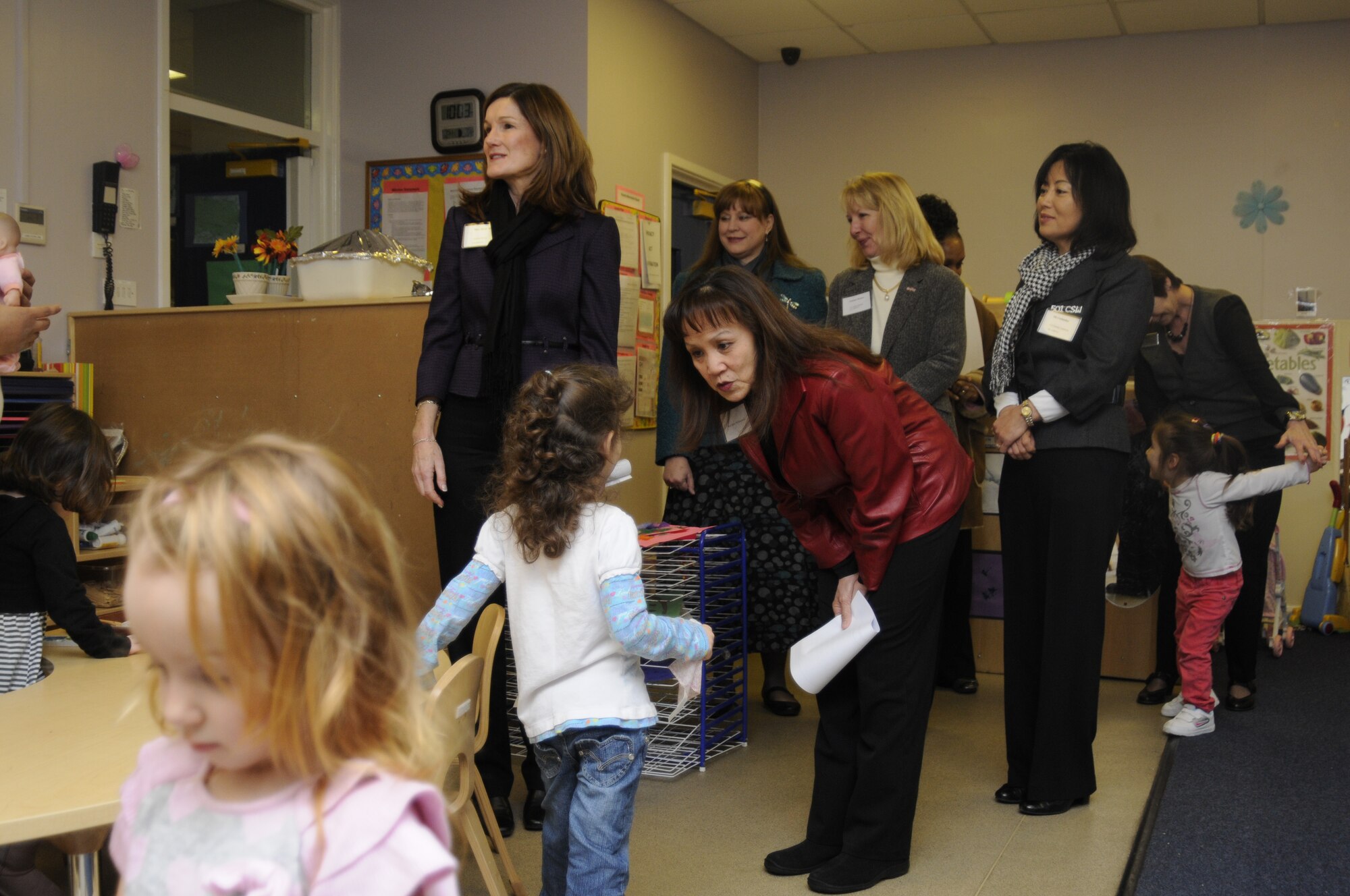 Mary Williamson talks to a girl Jan. 26 at the Child Development Center at RAF Croughton. Mrs. Williamson is the wife of United States Air Forces in Europe Command Chief, Chief Master Sgt. David Williamson, and visited the base as part of an orientation tour of 501st Combat Support Wing bases in the United Kingdom, Jan. 25, 2011. (U.S. Air Force photo by Staff Sgt. Joel Mease)