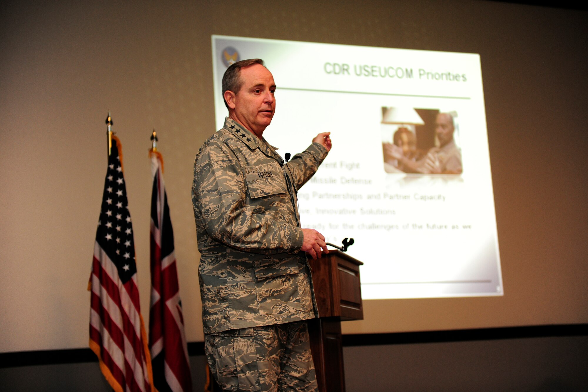 Gen. Mark Welsh, United States Air Forces in Europe commander, briefs Airmen at a commander’s call at the RAF Alconbury base theater, Jan. 25, 2011. The general spoke about the importance of Airmen in the wing and the significance of the jobs they do every day. (U.S. Air Force photo by Tech. Sgt. John Barton)