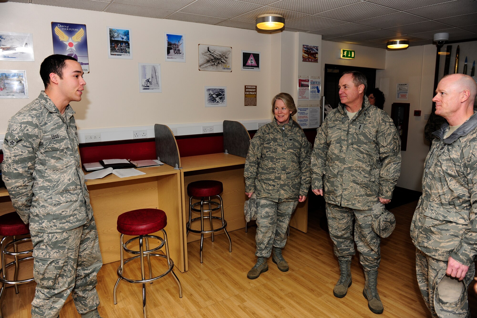 Airman Daniel Legg briefs Gen. Mark Welsh, Col. Amy Hammond and Chief Master Sgt. David Williamson in the RAF Alconbury Heritage Room Jan. 25, 2011, during a familiarization tour of 501st Combat Support Wing bases in the United Kingdom.  Colonel Hammond is the commander of the 423rd Air Base Group and Airman Legg is a member of the 423rd Communications Squadron. (U.S. Air Force photo by Tech. Sgt. John Barton)