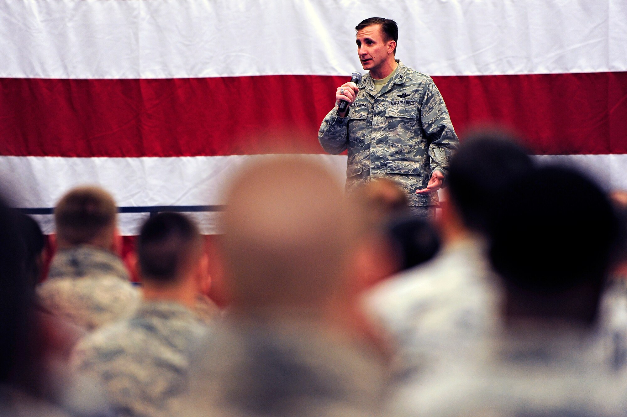 Col. Jeffrey Taliaferro, 28th Bomb Wing commander, addresses the 28th Bomb Wing during the quarterly 28th BW commander’s call on Ellsworth Air Force Base, S.D., Jan. 20, 2011.  Colonel Taliaferro commended the Airmen for their accomplishments over the past year and provided updates on a variety of topics ranging from aviation operations and maintenance schedules to successes the base has made in suicide prevention. (U.S. Air Force photo/Staff Sgt. Marc I. Lane) 

