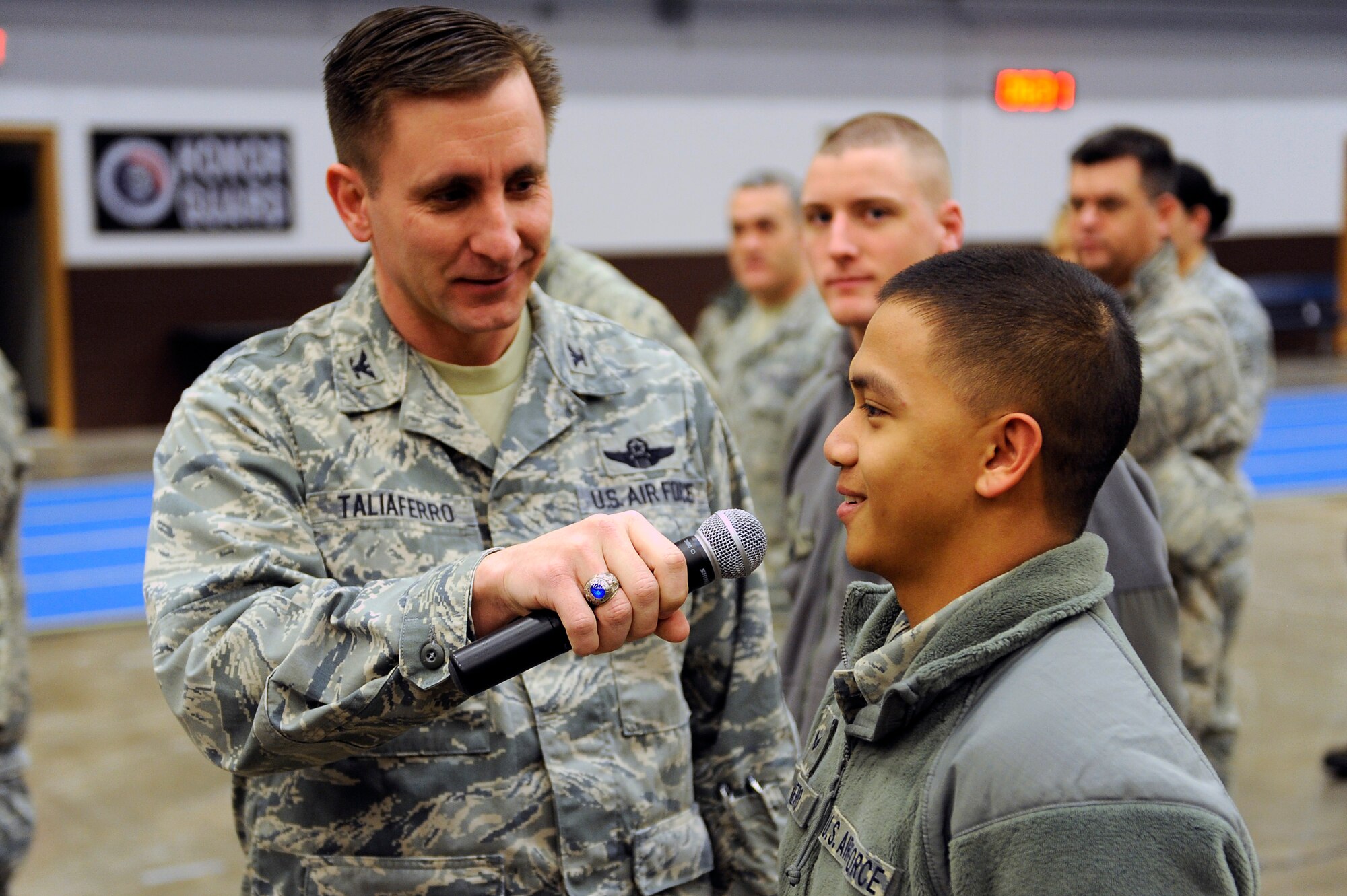 Senior Airman Anthony Pinero, 28th Civil Engineer Squadron engineering technician, explains how he “puts bombs on target” to Col. Jeffrey Taliaferro, 28th Bomb Wing commander, during the quarterly 28th BW commander’s call on Ellsworth Air Force Base, S.D., Jan. 20, 2011.  The 28th CES mission is to provide quality home-station engineer services for rapid, decisive, sustainable combat support, anytime-anywhere. (U.S. Air Force photo/Staff Sgt. Marc I. Lane)