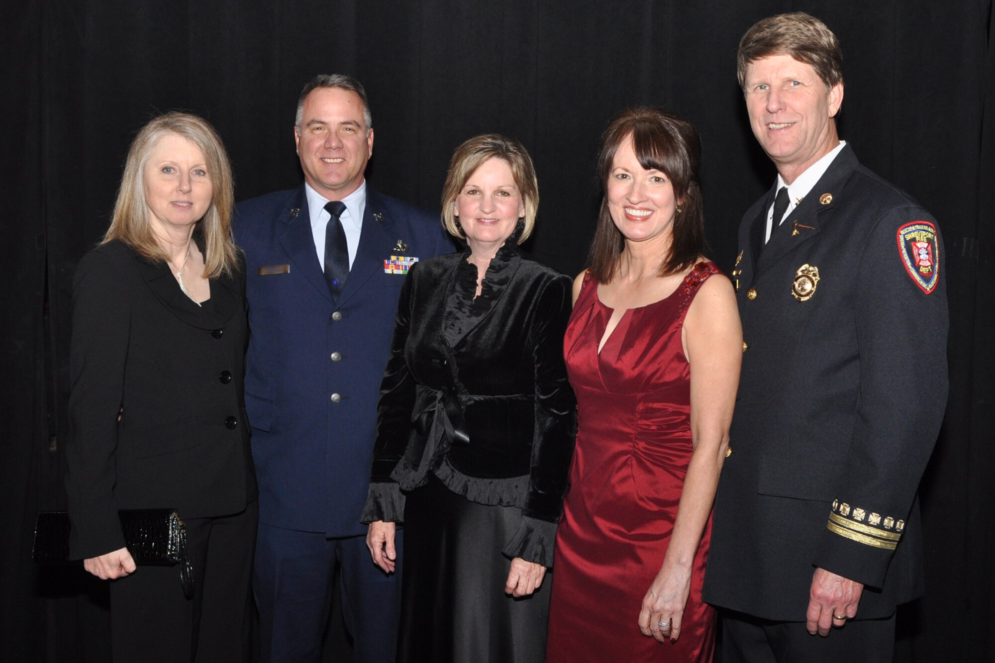 Stephanie L. Fischer, Master Sgt. Danny K. Fischer, B-52 armament systems supervisor, 307th Maintenance Squadron, Barksdale Air Force Base, La., Maureen Kidd, K9 Search and Rescue Training coordinator, Shreveport Fire Department, Joyce Foster, and Shreveport Fire Dept. Battalion Chief Kerry Foster, K9 Search and Rescue Task Force director, pose for a photo after Sergeant Fischer accepted the award for “2010 Patriot of the Year,” Military Reserves category, during the Bossier Chamber of Commerce’s 63rd Annual Membership Banquet at the Horseshoe Riverdome in Bossier City, La., Jan.25, 2011. Stephanie, who is married to Sergeant Fischer, is also a Master Sergeant in the U.S. Air Force Reserve, and is assigned to the 307th Maintenance Operations Squadron at Barksdale AFB. Sergeant Fischer credited Chief Foster and Ms. Kidd as his mentors and expressed they were the reason he won the award. Sergeant Fischer is also a K9 Search and Rescue Bloodhound Handler. He won out over two additional nominees from Air Force Reserve units at Barksdale AFB. The other nominees for the Reserve category were Technical Sgt. Jeffrey S. Walston, a public affairs technician with the 307th Bomb Wing and Senior Airman Kimberly Simon, a flight avionics specialist from the 917th Aircraft Maintenance Squadron. (U.S. Air Force photo/Tech. Sgt. Jeff Walston)