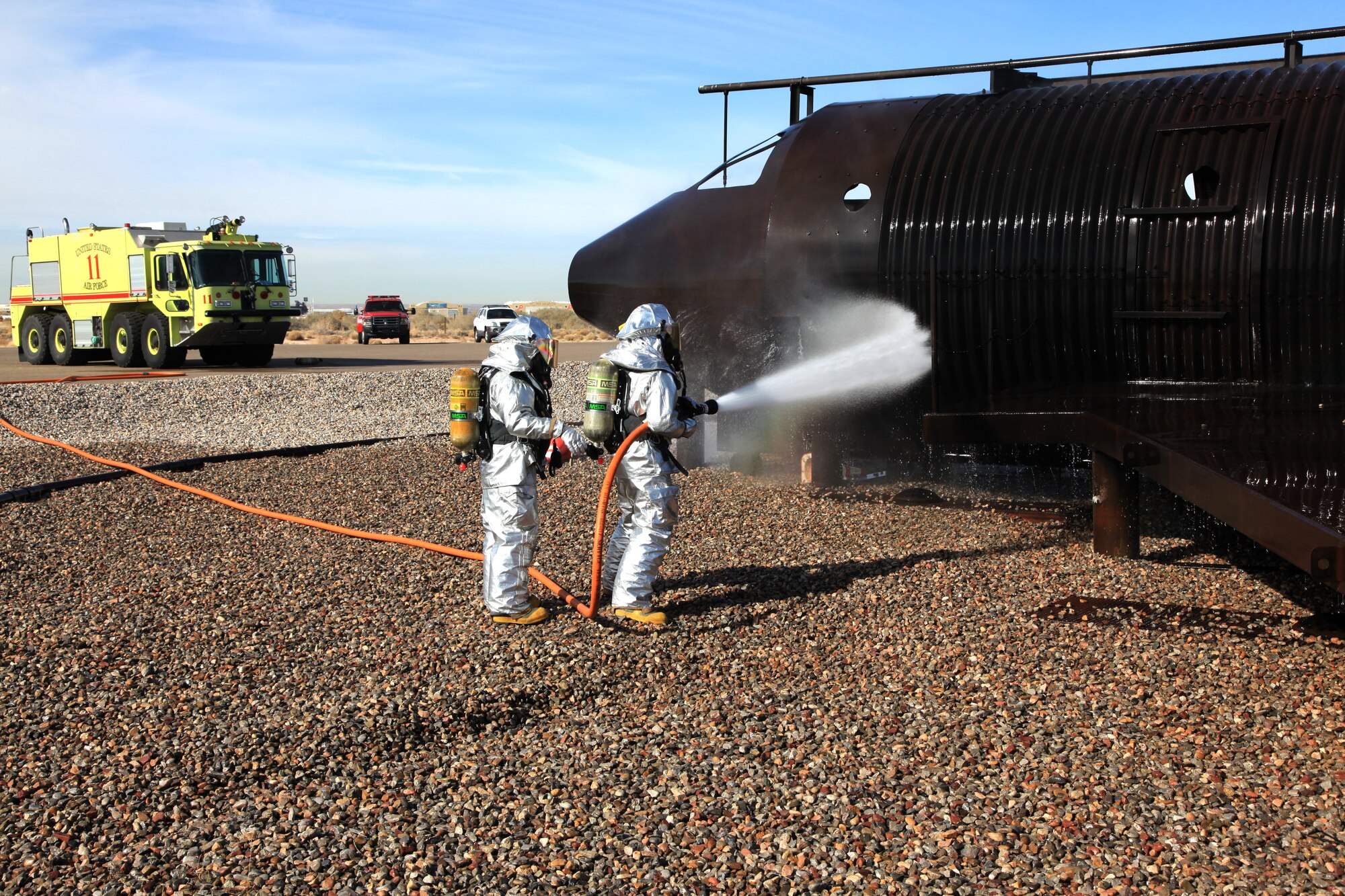 377th Air Base Wing fire department crews respond to an Operational Readiness Exercise aircraft fire Jan. 25 at the aircraft fire pit on the south side of the runway.  
Team Kirtland participated in an exercise Jan. 24 to 28 in preparation for the Operational Readiness Inspection in March.
The exercise included various elements to prepare units for the upcoming ORI.
U.S. Air Force Photo by Edward C. Harrison