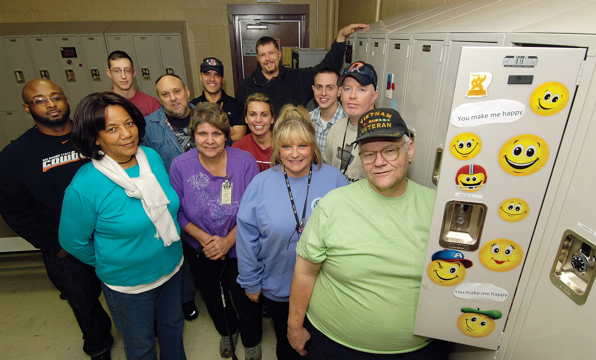 In the Oxygen Shop of the 550th Commodities Maintenance Squadron, Gary Dacus found his locker decorated Jan. 24 by an unknown co-worker during the shop’s Secret Wingman activity. Employees in the shop decorate lockers, leave treats, small gifts or cheerful notes all in the Wingman spirit. Some of the employees participating in the Secret Wingman are, front row from left, Gail Simmons, Cathy Ross, Sheral King and Gary Dacus. Middle row, from left, Calvin Elam, Tom Bowser, Dana Carson, Paul Wilmoth and Curtis James. Back row, from left, Cory Dean, Jose Vega and John Shrabel. (Air Force photo by Margo Wright)