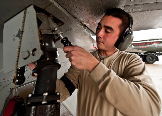 Senior Airman Mark Redmond, 756th Aircraft Maintenance Squadron, connects the hose to the F-16 to be refueled after a 33rd Fighter Wing sortie Jan. 25.  F-16s from Luke Air Force Base, Ariz., are being used by the wing to fly local area orientation sorties and develop a “battle rhythm leading up to the arrival of the first F-35 Joint Strike Fighter.  (U.S. Air Force photo/Samuel King Jr.)