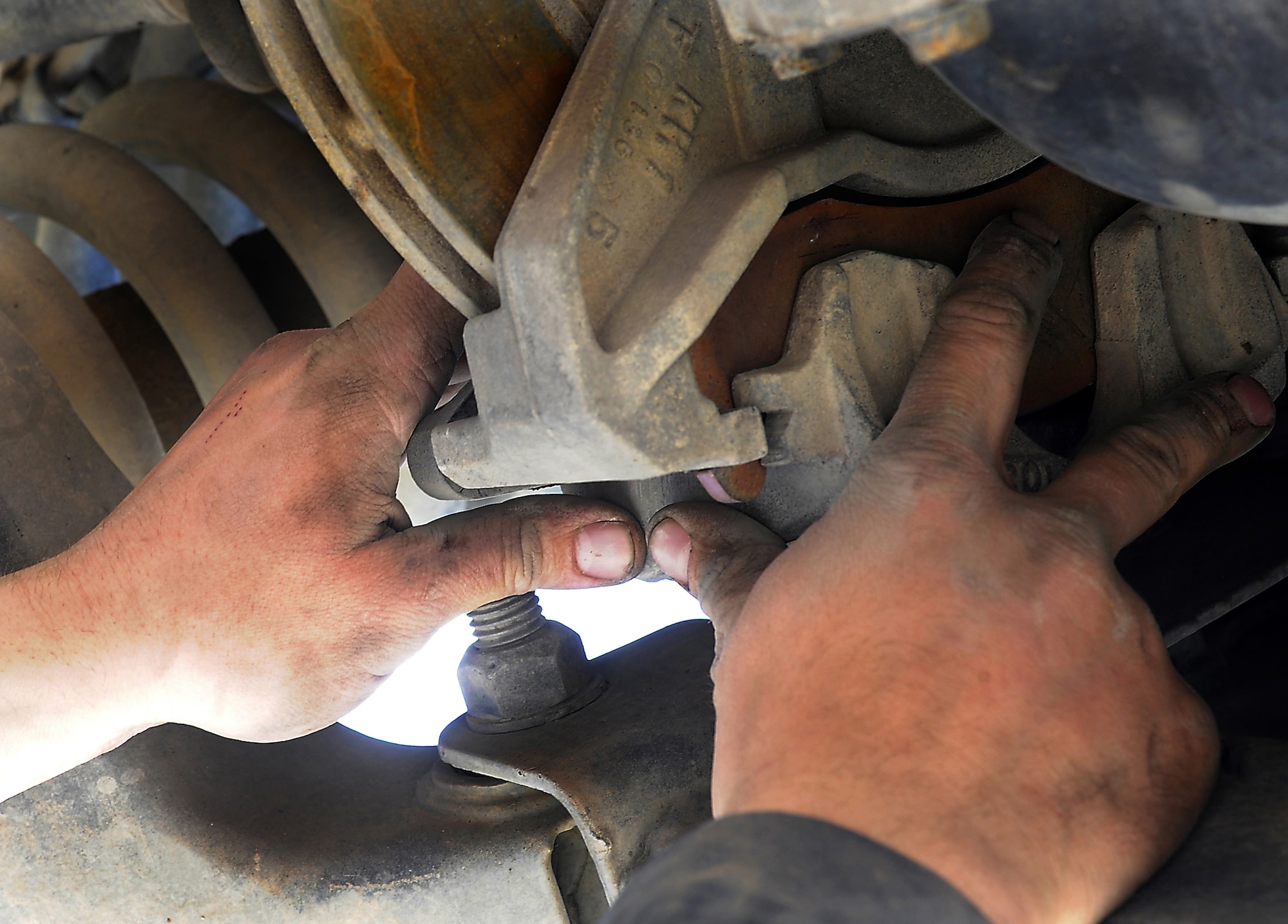 Airman 1st Class Josh Edwards ensures a brake pad is properly seated during routine maintenance on a vehicle Jan. 27, 2011, at Kandahar Airfield, Afghanistan. The fine dirt and dust in southern Afghanistan is particularly rough on the vehicles parts and requires them to be maintained more frequently. Airman Edwards, from Malmstrom Air Force Base, Mont., is a special purpose vehicle mechanic assigned to the 451st ELRS. (U.S. Air Force photo/Senior Airman Willard E. Grande II/Released)