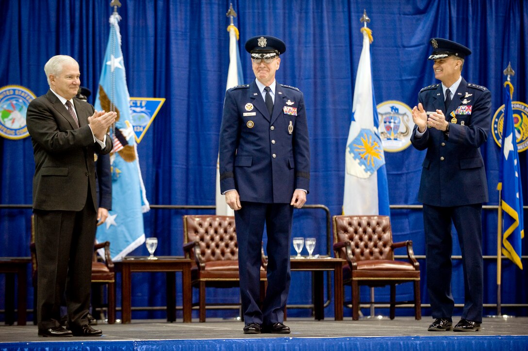 Defense Secretary Robert M. Gates and Air Force Gen. Kevin P. Chilton, outgoing commander, U.S. Strategic Command, congratulate Air Force Gen. C. Robert Kehler, incoming commander, during the U.S. Strategic Command change-of-command ceremony on Offutt Air Force Base, Neb., Jan. 28, 2011.
