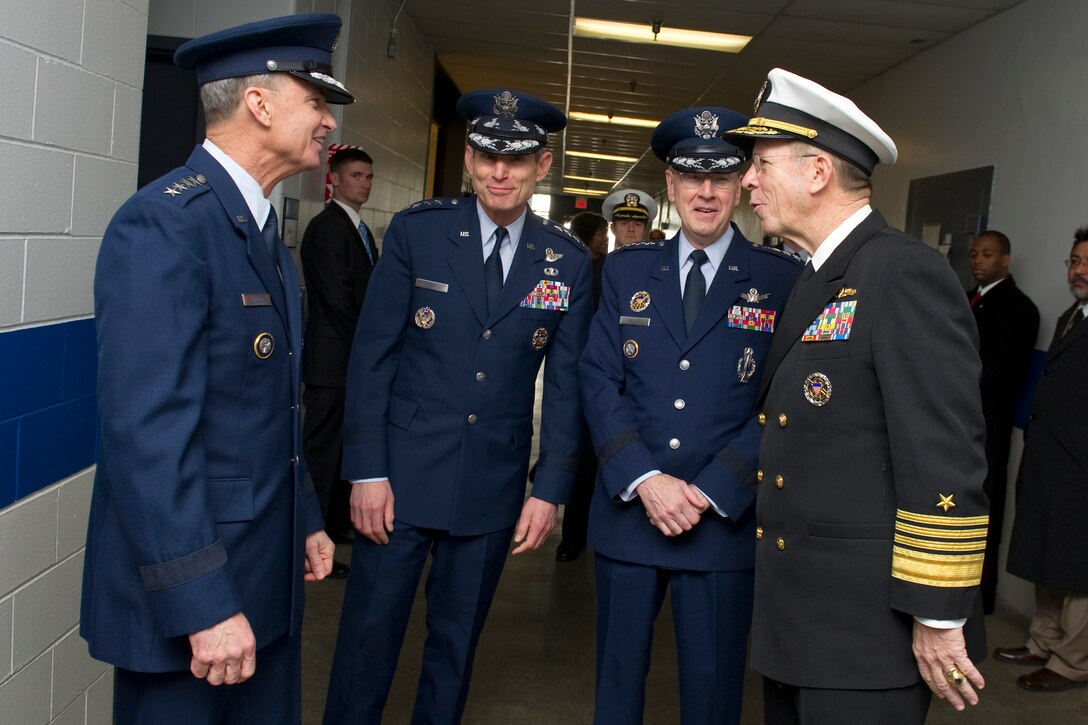 From left to right, Air Force Gen. Kevin P. Chilton, outgoing commander, U.S. Strategic Command, Air Force Chief of Staff Gen. Norton A. Schwartz, Air Force Gen. C. Robert Kehler, incoming commander, and Navy Adm. MIke Mullen, chairman of the Joint Chiefs of Staff, speak before the U.S. Strategic Command change-of-command ceremony on Offutt Air Force Base, Neb., Jan. 28, 2011.