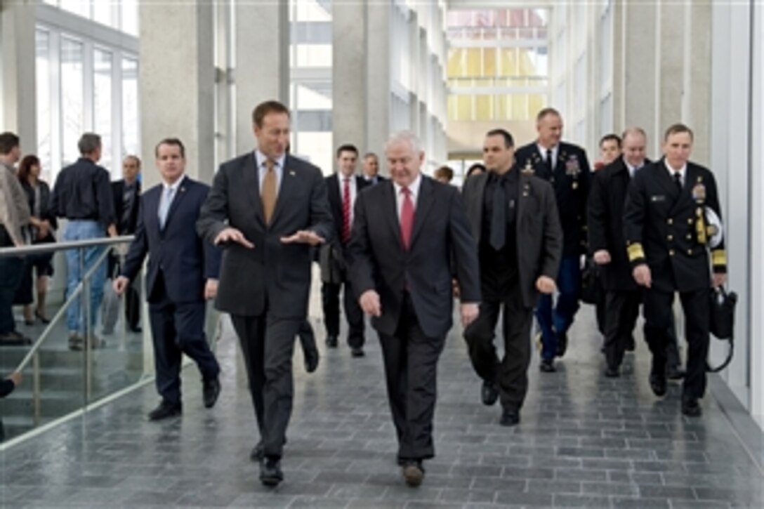 Secretary of Defense Robert M. Gates walks with Canadian Defense Minister Peter MacKay at the Old City Hall in Ottawa, Canada, on Jan. 27, 2011.  Gates is in Canada to attend trilateral meetings with his counterparts from Canada and Mexico, but the Mexican Defense Minister fell ill and could not attend the meetings.  Gates and MacKay continued the discussions on topics such as Afghanistan, hemisphere issues, as well as Russia and China.  