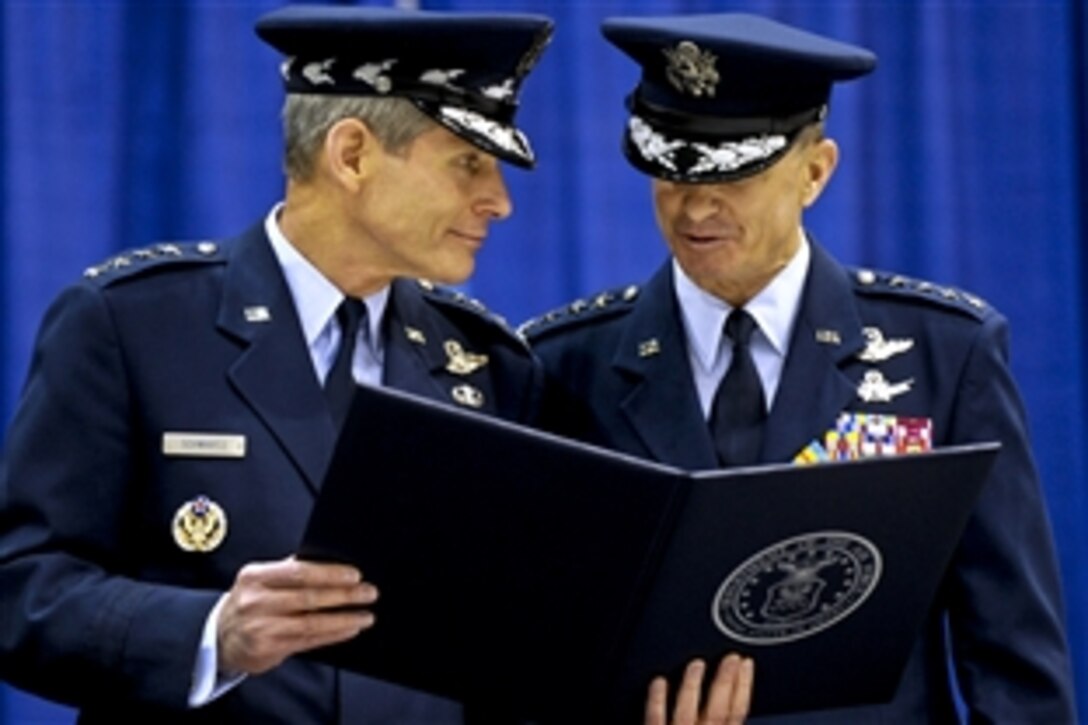 Air Force Chief of Staff Gen. Norton Schwartz presents the certificate of retirement to Air Force Gen. Kevin P. Chilton, outgoing commander, U.S. Strategic Command, on Offutt Air Force Base, Neb., Jan. 28, 2011.