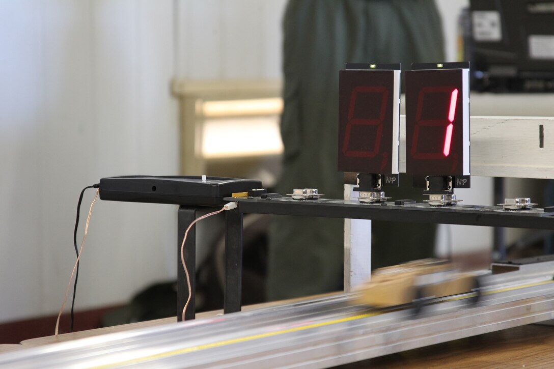 A car in lane one finishes first during the Cub Scout’s Pinewood Derby at the Combat Center’s Scout Hut Jan 29, ,2011. Pinewood Derby cars can reach an estimated speed of 20mph.