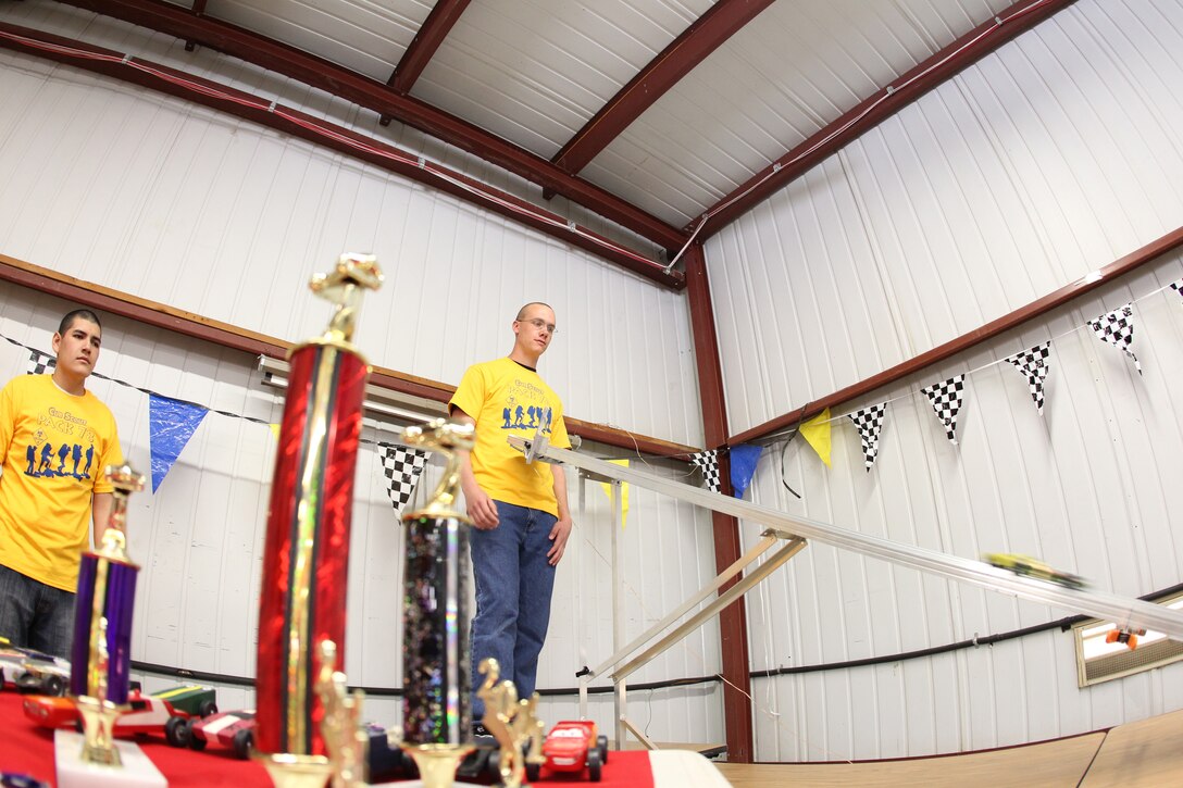Volunteers from the Marine Corps Communication-Electronics School set up and ran the races for the Cub Scout’s Pinewood Derby at the Combat Center’s Scout Hut Jan 29, 2011.