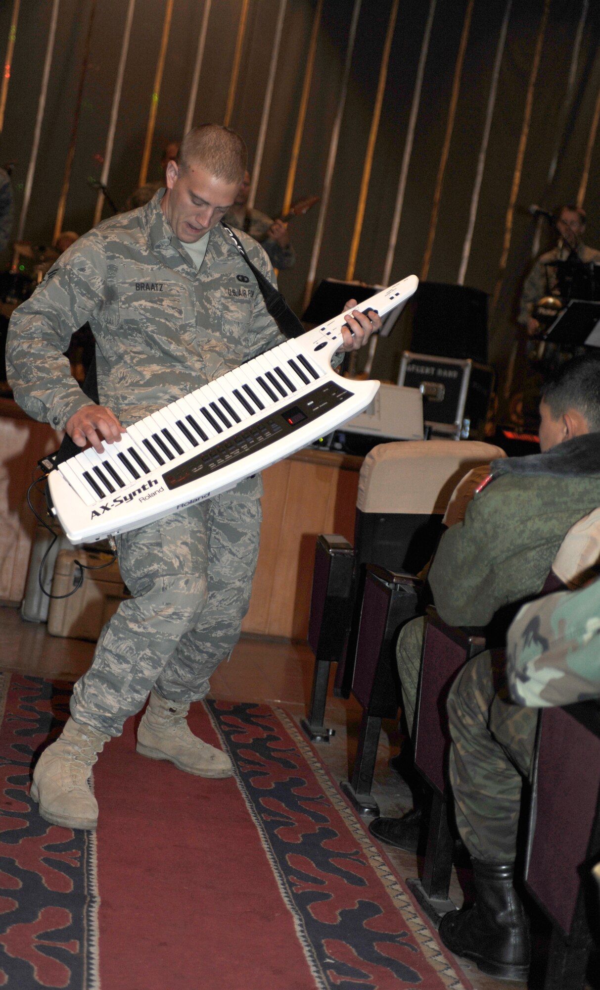 BISHKEK, Kyrgyzstan -- Senior Airman Adam Braatz, U.S. Air Forces Central "Starlifter" band keyboardist, solos during a performance in Frunze--a  Kyrgyz military academy--in Biskek, Thursday.  The Starlifter band performed a wide variety of music for the Kyrgyz military community to enjoy. (U.S. Air Force photo/ Tech. Sgt. Jerome C. Baysmore) 
