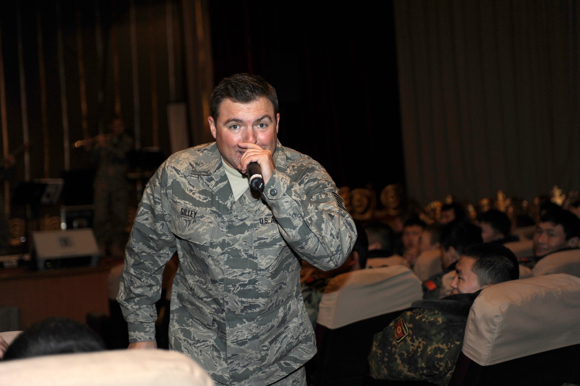 BISHKEK, Kyrgyzstan -- Tech. Sgt. Jamie Gilley, U.S. Air Forces Central "Starlifter" band vocalist, takes his solo through the crowd during a performance in Frunze--a  Kyrgyz military academy--in Biskek, Thursday.  The Starlifter band performed a wide variety of music for the Kyrgyz military community to enjoy. (U.S. Air Force photo/ Tech. Sgt. Jerome C. Baysmore) 
