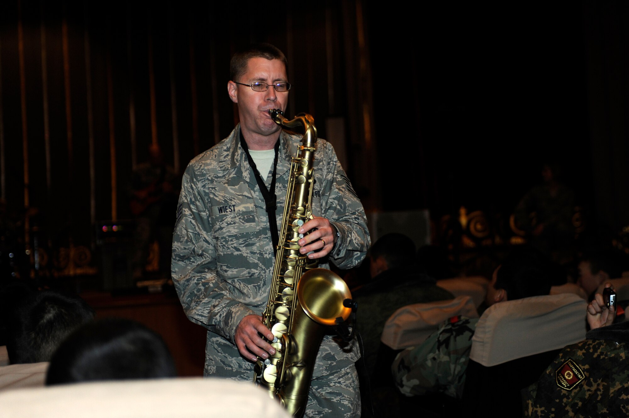 BISHKEK, Kyrgyzstan -- Tech. Sgt. Dwight Wiest, U.S. Air Forces Central "Starlifter" band saxophonist, takes his solo through the crowd during a performance in Frunze--a  Kyrgyz military academy--in Biskek, Thursday.  The Starlifter band performed a wide variety of music for the Kyrgyz military community to enjoy. (U.S. Air Force photo/ Tech. Sgt. Jerome C. Baysmore) 
