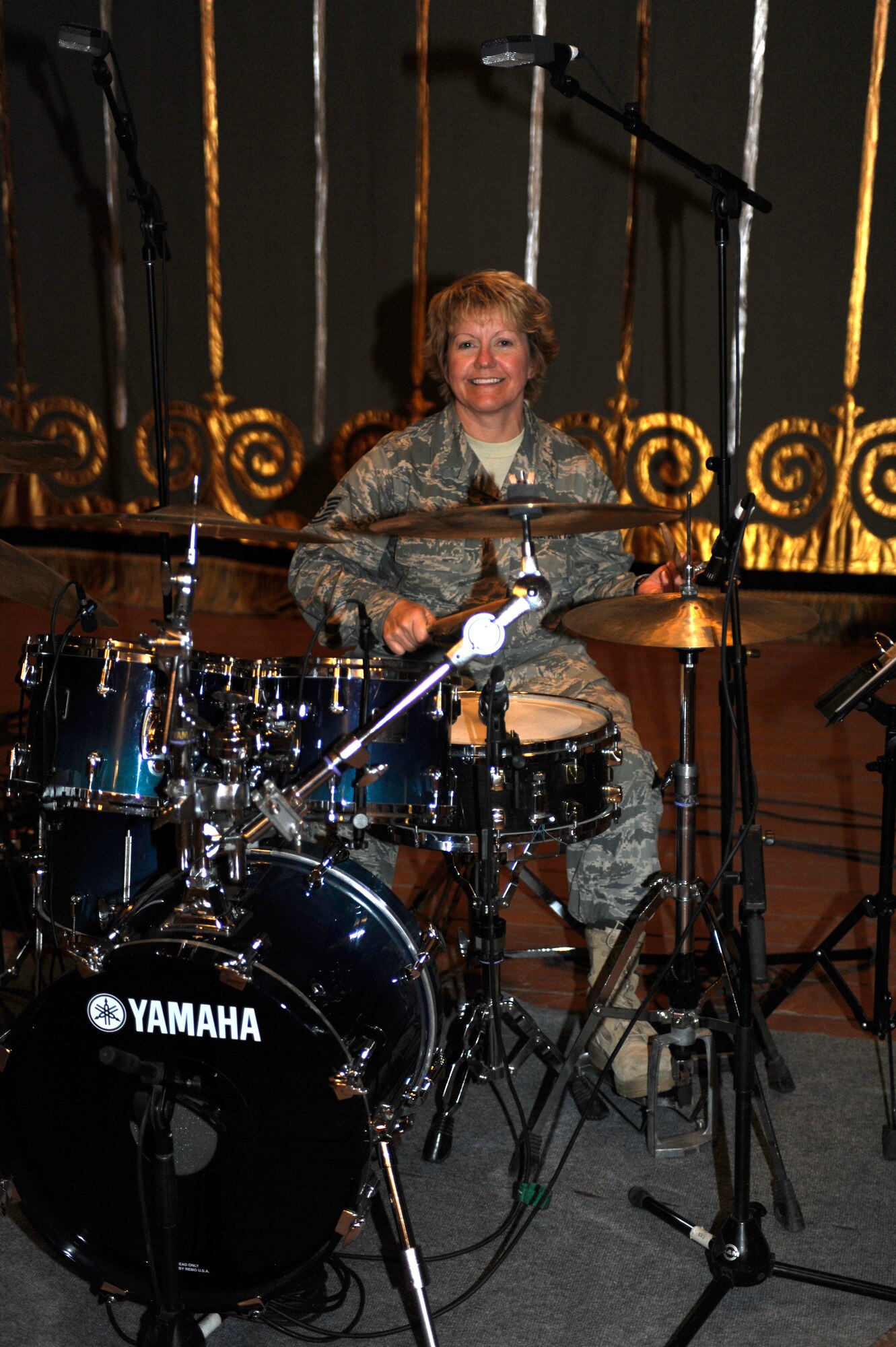 BISHKEK, Kyrgyzstan -- Tech. Sgt. Christi McGowan, U.S. Air Forces Central "Starlifter" band drummer, keeps time during a performance in Frunze--a  Kyrgyz military academy--in Biskek, Thursday.  The Starlifter band performed a wide variety of music for the Kyrgyz military community to enjoy. (U.S. Air Force photo/ Tech. Sgt. Jerome C. Baysmore) 
