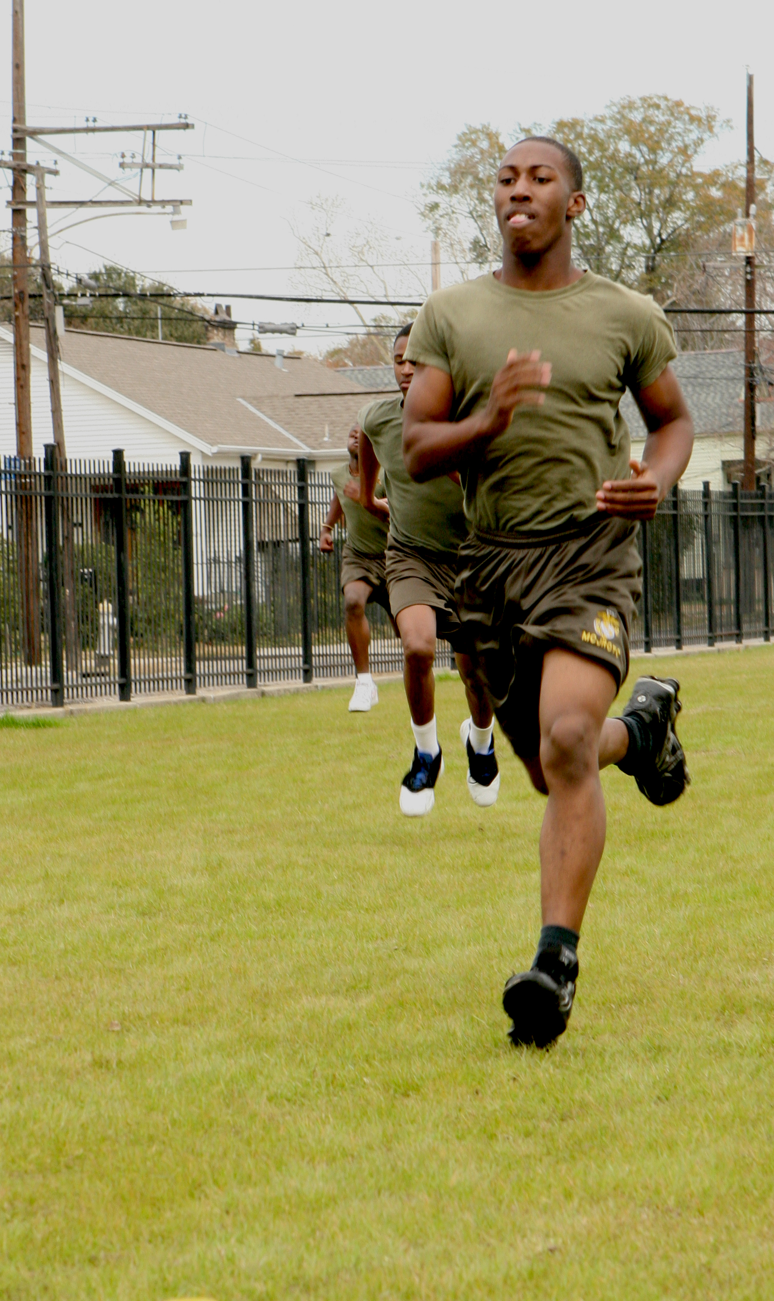 A Junior ROTC cadet from Willowridge High School in Houston sprints to finish a 300-yard run during a physical fitness competition at Jesuit High School here Jan. 29.