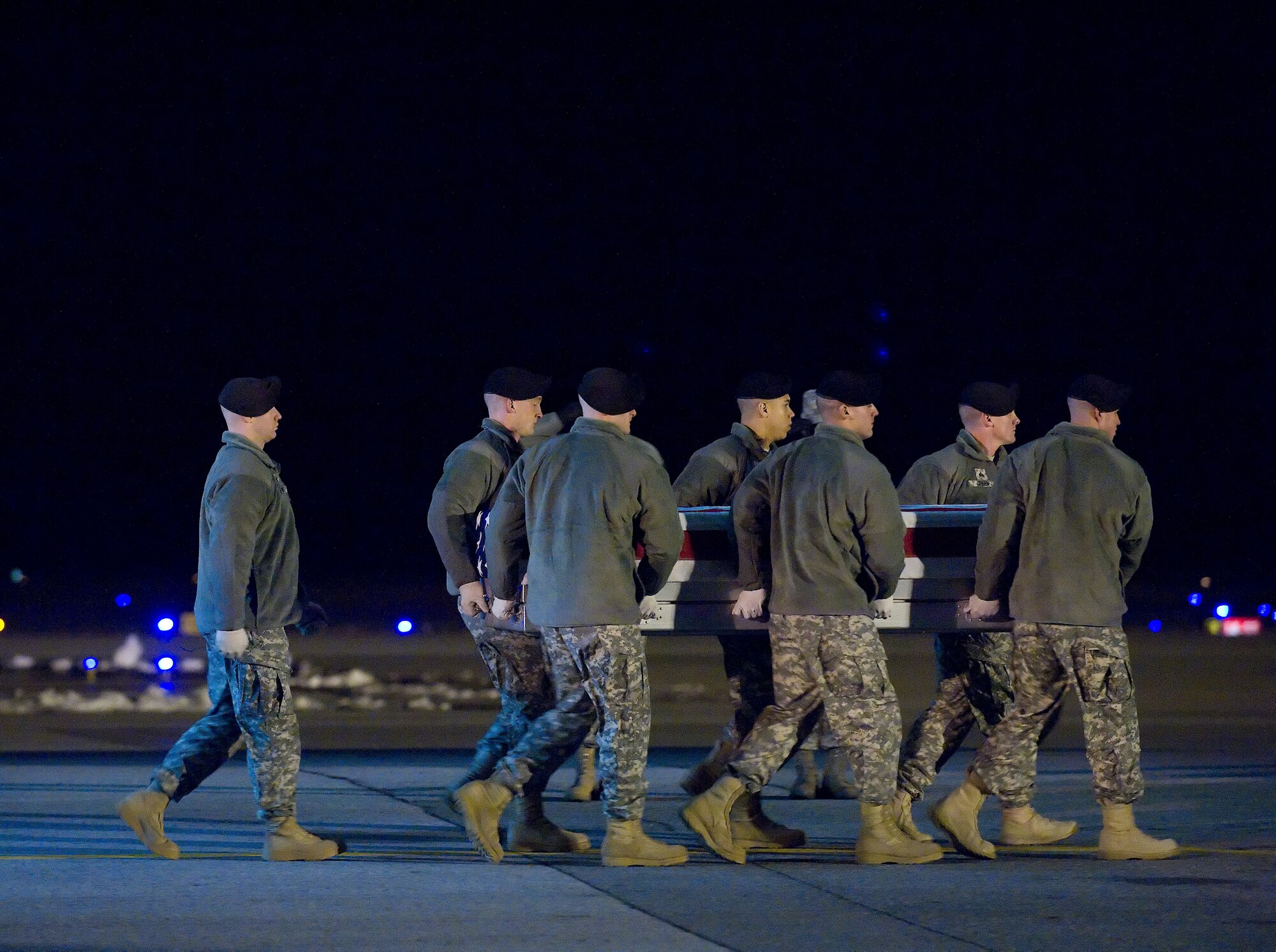 A U.S. Army carry team transfers the remains of Army Sgt. First Class Anthony Venetz Jr. of Prince William, Va., at Dover Air Force Base, Del., Jan. 30, 2011.  (U.S. Air Force photo by Jason Minto)