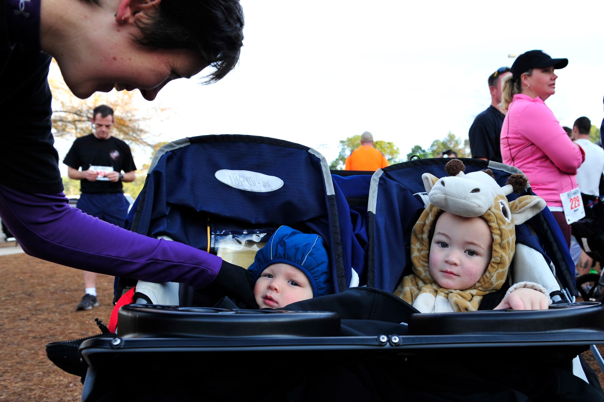 Erika Blankenship, wife of U.S. Air Force Staff Sgt. Andrew Blankenship, 4th Special Operations Squadron,  bundles sons Ander and Andrik for the Spirit 03 14K and 5K, Hurlburt Field, Fla., Jan. 30, 2011.  The run was the first of a series of events scheduled to pay tribute to the fallen crew of Spirit 03, an AC-130H Spectre Gunship lost during Desert Storm. (U.S. Air Force photo by Staff Sgt. Stephanie Jacobs/RELEASED)