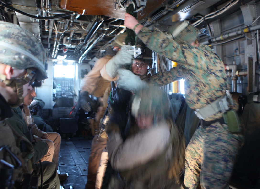 Marines and Sailors with the Security Element Platoon, Headquarters and Service Company, Battalion Landing Team 1st Battalion, 2nd Marine Regiment, 24th Marine Expeditionary Unit, fast rope onto the USS Iwo Jima from a CH-53E Super Stallion helicopter in preparation for an upcoming  simulated Expanded Visit, Board, Search and Seizure, Jan. 30, 2012.  The 24th MEU is conducting their Certification Exercise (CERTEX) with Iwo Jima Amphibious Ready Group scheduled Jan. 27 to Feb. 17, which includes a series of missions intended to evaluate and certify the unit for their upcoming deployment.  The CH-53E helicopters are a detachment from HMH-464 based at Marine Corps Air Station New River, N.C., and comprise part of Marine Medium Tiltrotor Squadron VMM-261 (Rein), which is the Aviation Combat Element for the 24th MEU.