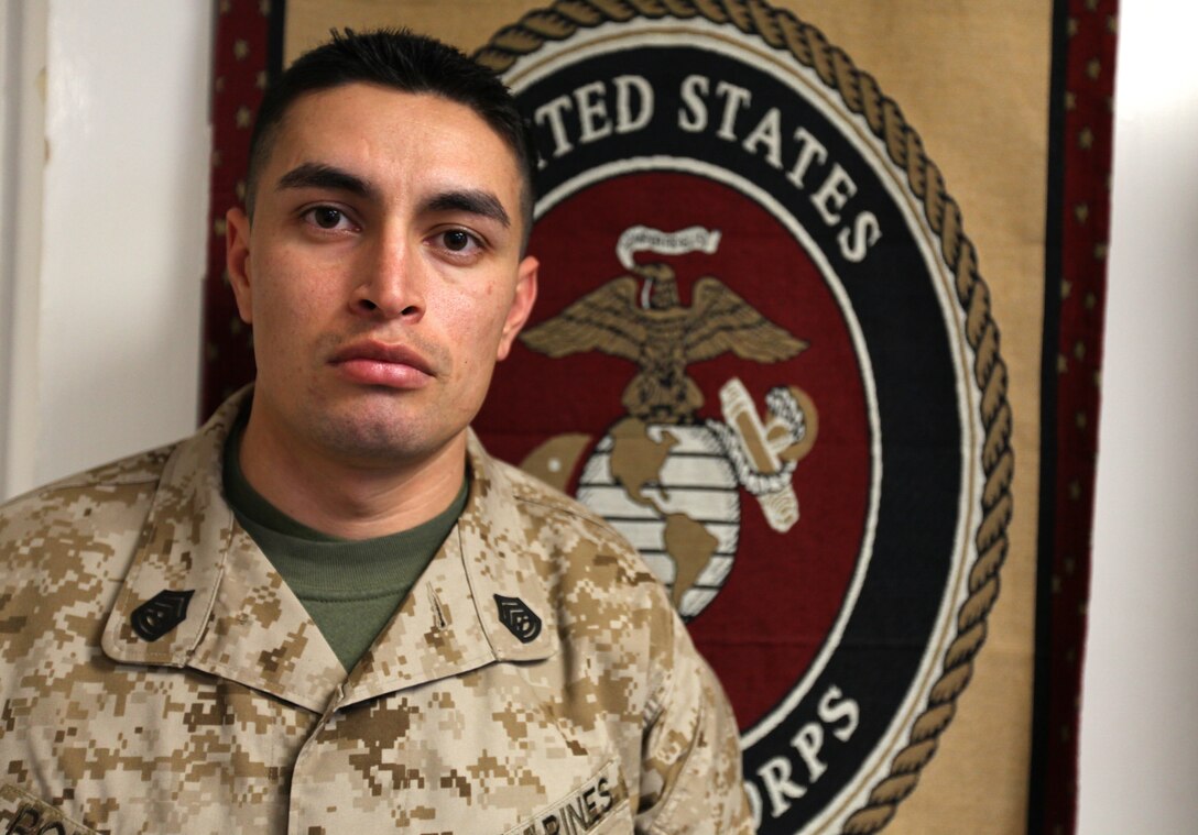 Gunnery Sergeant Esteban Rodriguez stands inside the division career planners office, Jan 31.  He recently received the Commandants Career Planner of the Year Award for 2010 and was meritoriously promoted to his present rank.