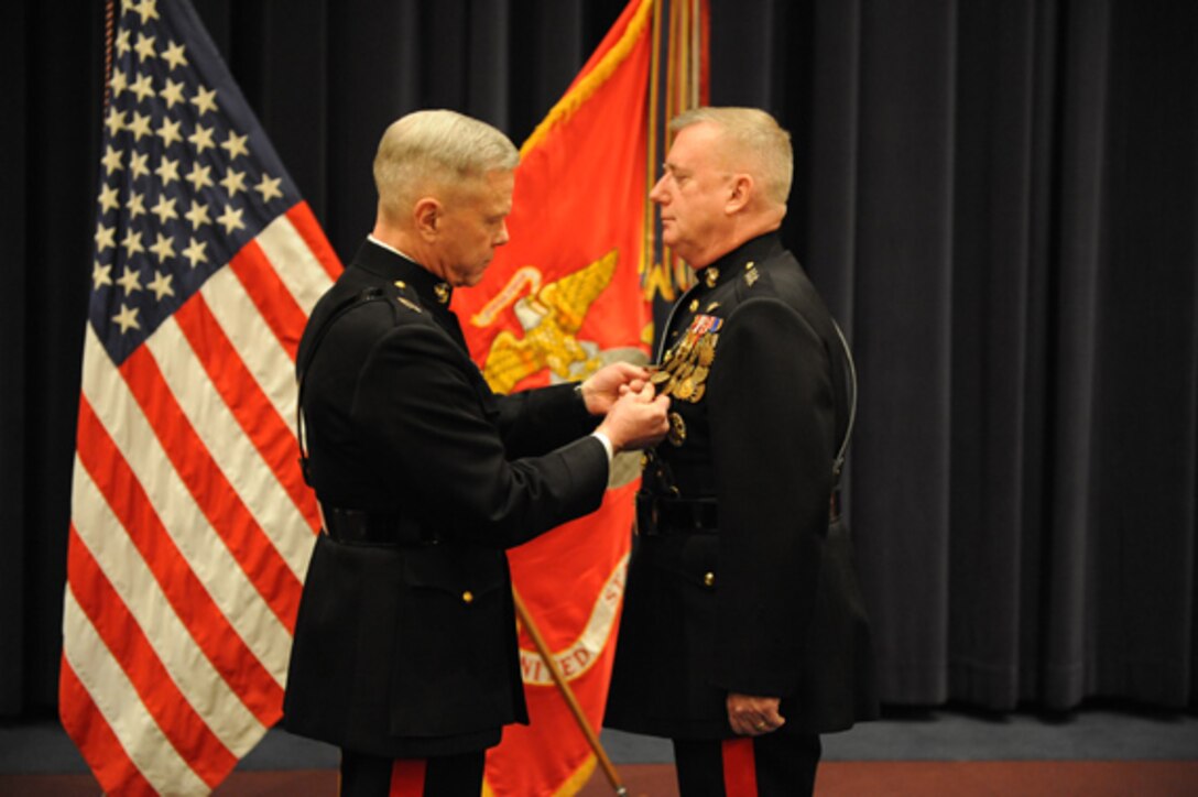 Marines with Headquarters and Service Company, 2nd Battalion, 4th Marine Regiment, dig their survival shelters Jan. 31, 2011, at Marine Corps Mountain Warfare Training Center, Bridgeport, Calif.