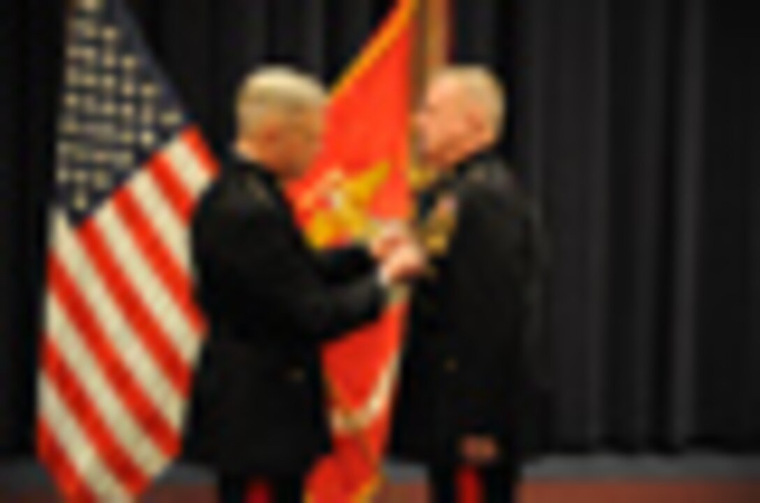 Marine with Headquarters and Services Company, 2nd Battalion, 4th Marine Regiment, digs his survival shelter Jan. 31, 2011, at Marine Corps Mountain Warfare Training Center, Bridgeport, Calif.