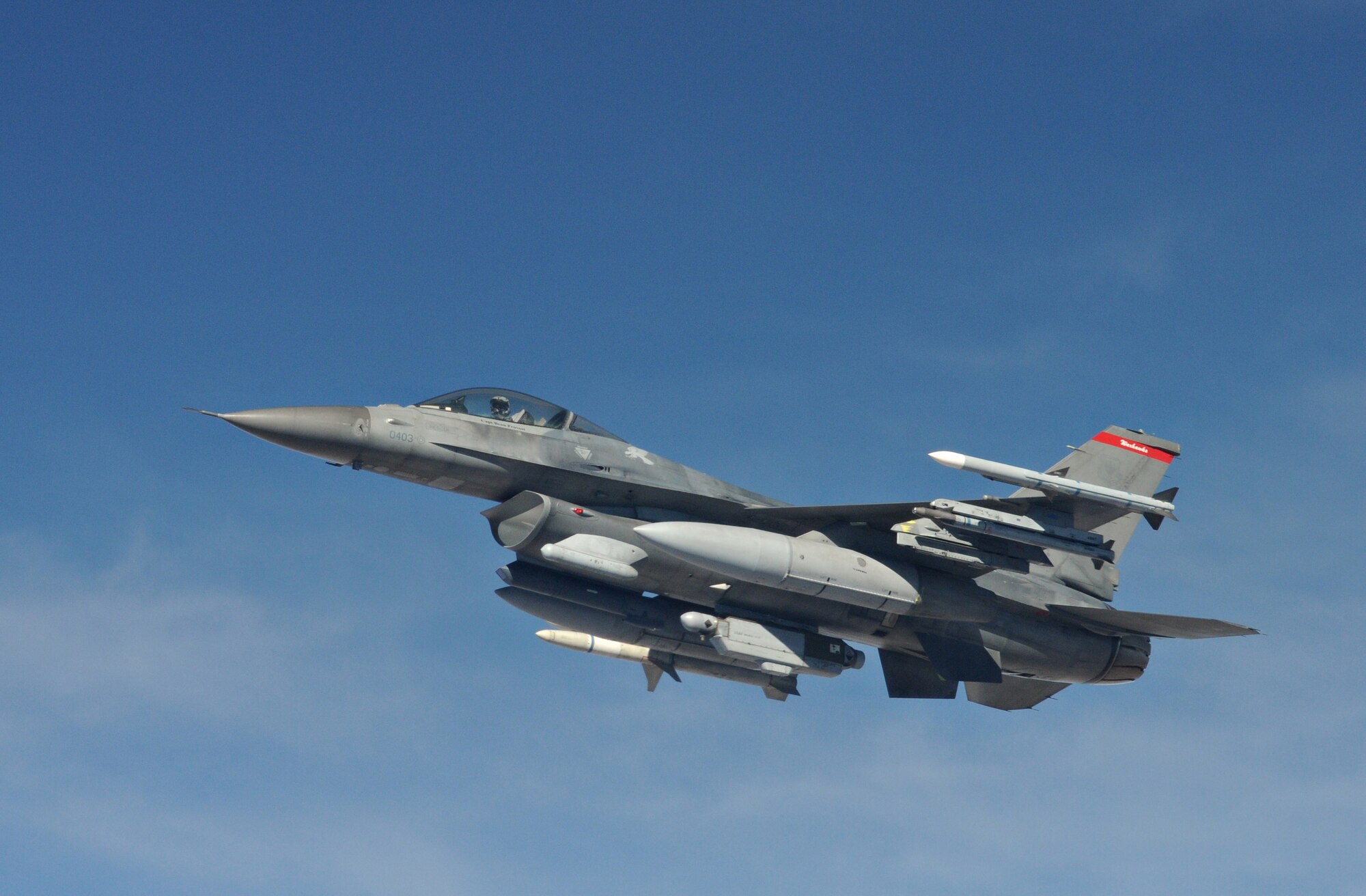 NELLIS AIR FORCE BASE, Nev. -- An F-16 Fighting Falcon departs from the side of a KC-135 Stratotanker after refueling during Red Flag 11-2 Jan. 27. Red Flag is a combined exercise that provides a realistic combat training environment to the U.S. and its allies. (U.S. Air Force photo/Staff Sgt. Benjamin Wilson)