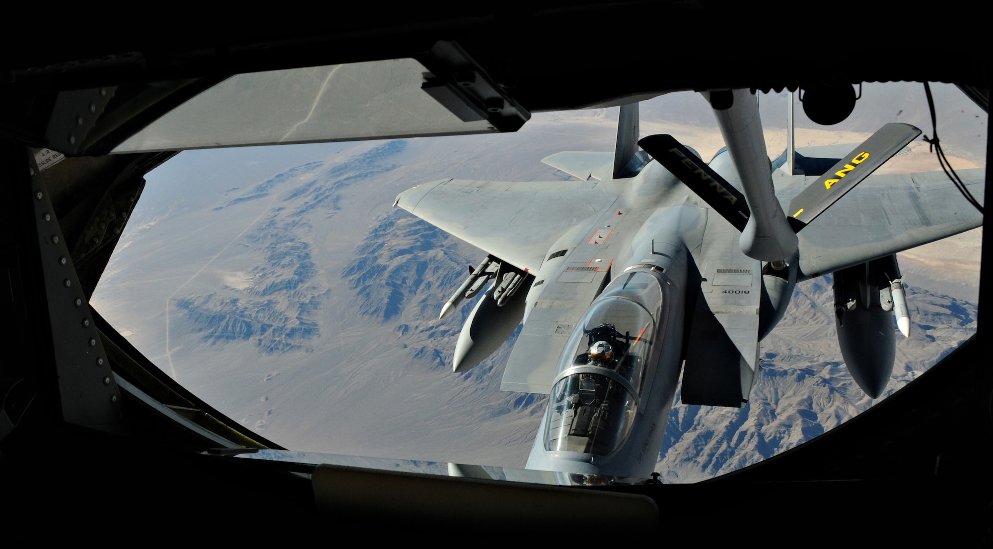 NELLIS AIR FORCE BASE, Nev. -- A KC-135 Stratotanker refuels an F-15 Strike Eagle during Red Flag 11-2 Jan. 27. Red Flag is a combined exercise that provides a realistic combat training environment to the U.S. and its allies. (U.S. Air Force photo/Staff Sgt. Benjamin Wilson)