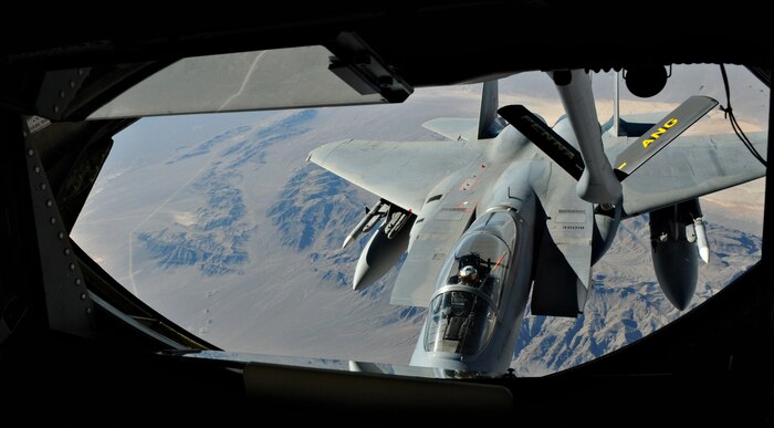 NELLIS AIR FORCE BASE, Nev. -- A KC-135 Stratotanker refuels an F-15 Strike Eagle during Red Flag 11-2 Jan. 27. Red Flag is a combined exercise that provides a realistic combat training environment to the U.S. and its allies. (U.S. Air Force photo/Staff Sgt. Benjamin Wilson)