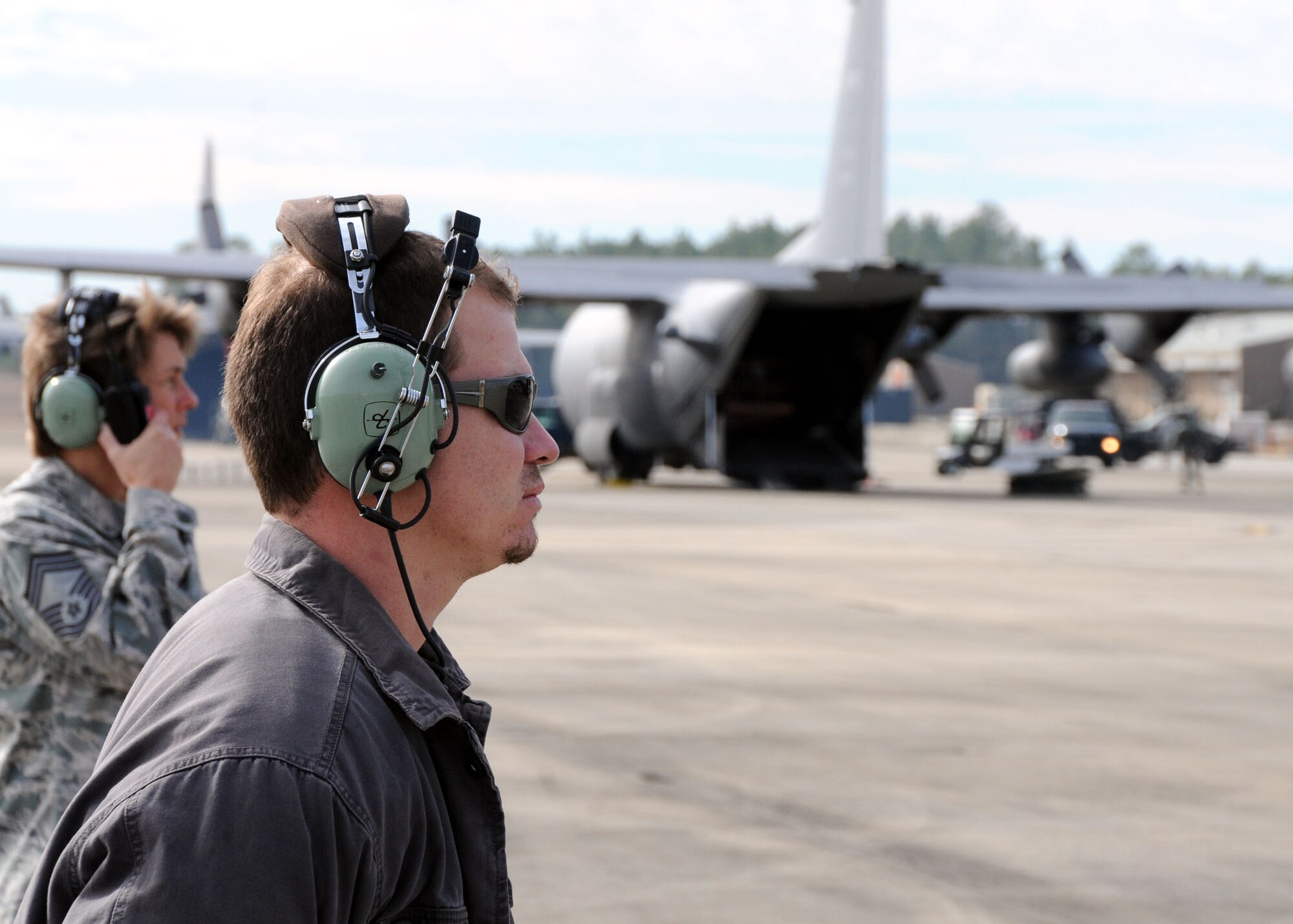 Technical Sgt. Paul Greene, 919th Maintenance Squadron, observes as several 919th Special Operations Wing MC-130E aircraft park on the Duke Field flightline Jan. 28.   The aircraft returned home after being temporarily stationed at nearby Eglin Air Force Base, Fla., during an eight-month airfield construction project.  (U.S. Air Force photo/Staff Sgt. Jonathan McCallum)