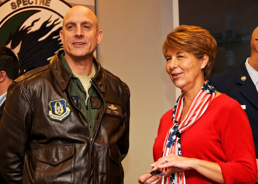 Colonel Andy Comtois, 919th Special Operations Wing commander, introduces Lynn Yort, as his new honorary wing commander during a recent induction ceremony at Duke Field.   Five other local civic leaders were similarly inducted in a one-year program aimed at increasing their understanding and support for the 919th SOW and the mission of its Air Force reservists in national defense.  (U.S. Air Force photo/Tech. Sgt. Samuel King Jr.)  