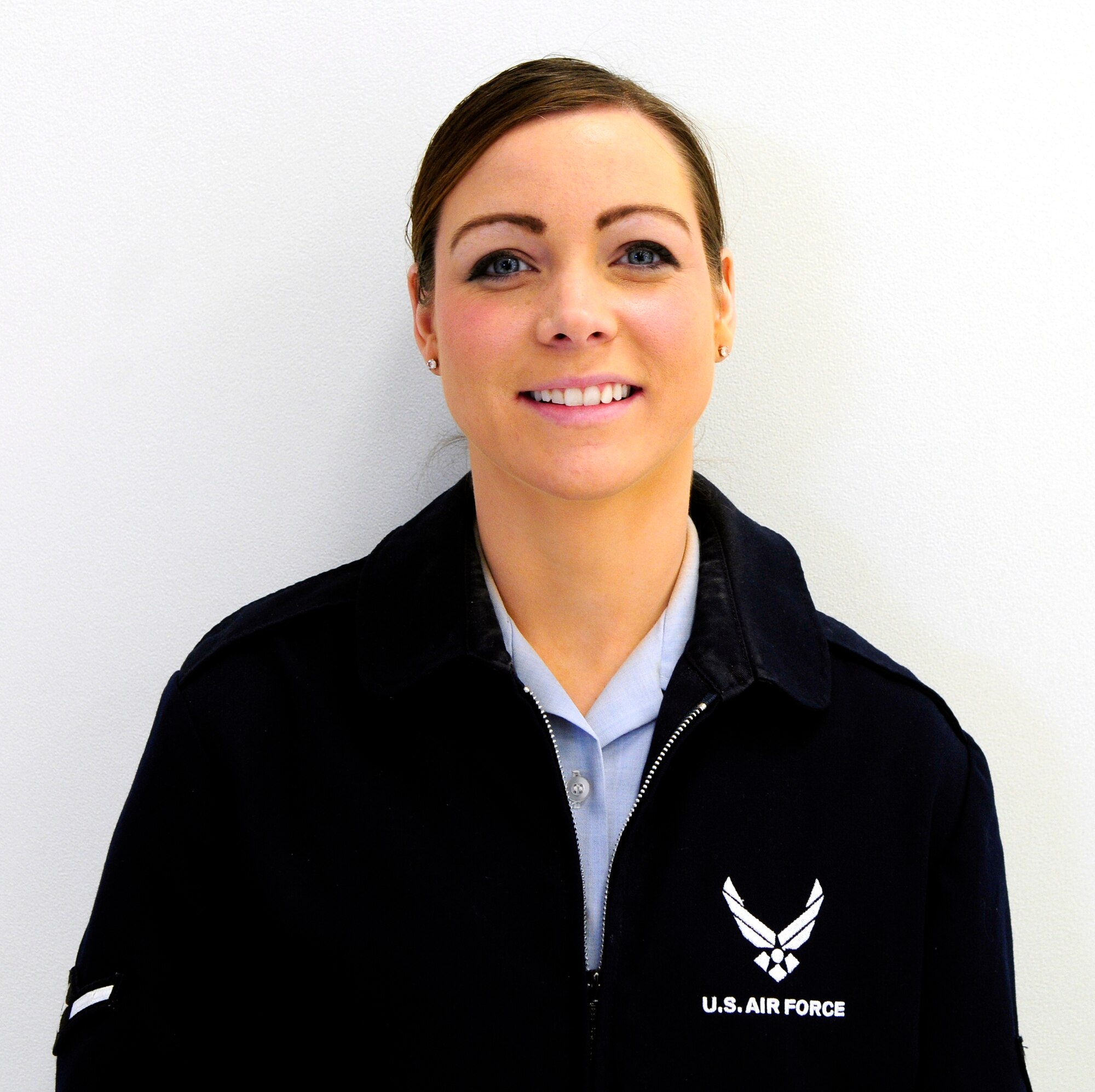 Airman 1st Class Lena Brennan plans on enjoying football festivities with her husband.  She looks forward to spending the afternoon watching her husband cheer his team to victory.  (U.S. Air Force photo by/Airman 1st Class Yash Rojas)