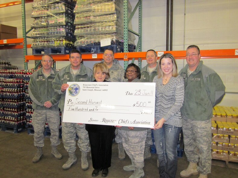 The 139th Airlift Wing, Missouri Air National Guard, Chief's council presents a donation to Second Harvest in St. Joseph, MO., from funds raised through an annual golf tournament on January 24, 2011. 