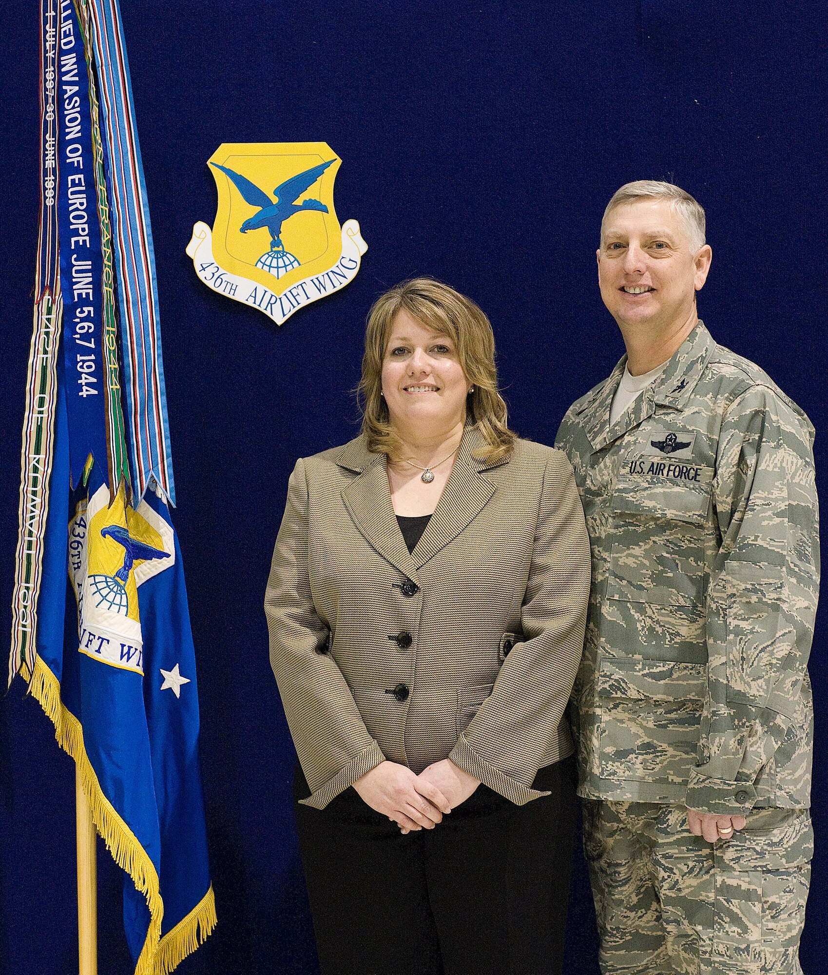 Col. Mark Camerer and his wife, Julie, come together for a photo after the 436th Airlift Wing change of command ceremony Jan. 27, 2011. During the ceremony, Colonel Camerer took command of the 436 AW. (U.S. Air Force photo/Jason Minto)