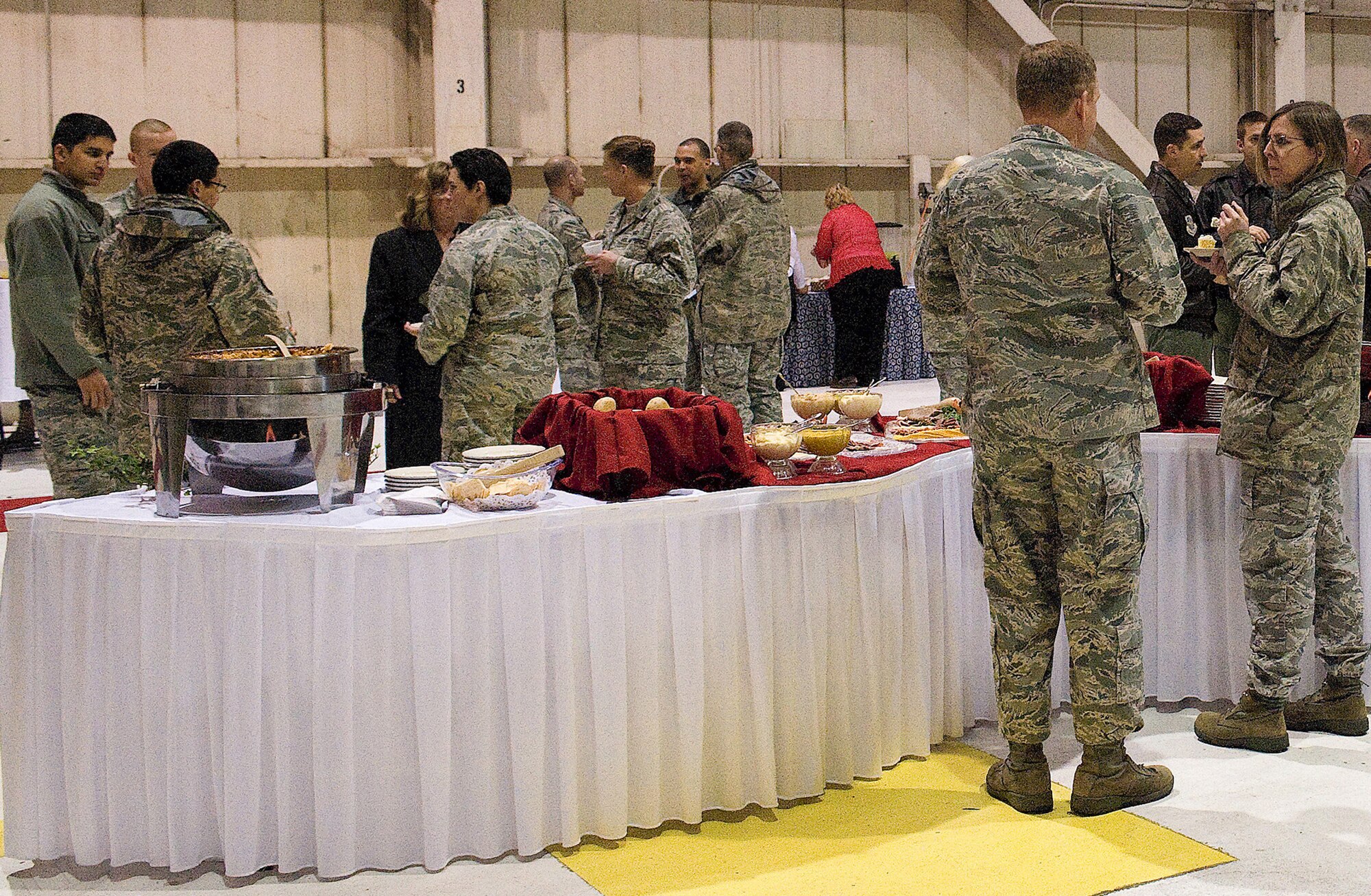 Team Dover members mingle during the reception after the 436th Airlift Wing change of command ceremony Jan. 27, 2011. (U.S. Air Force photo/Jason Minto)
