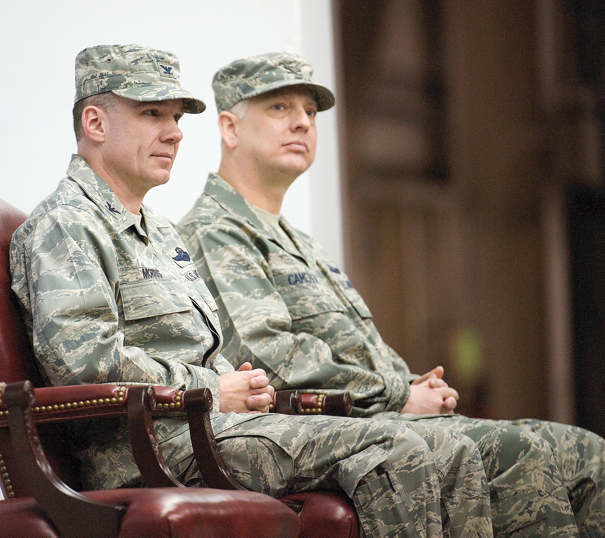Col. Manson Morris (left) and Col. Mark Camerer watch the formation during the 436th Airlift Wing change of command ceremony Jan. 27, 2011.  (U.S. Air Force photo/Jason Minto)