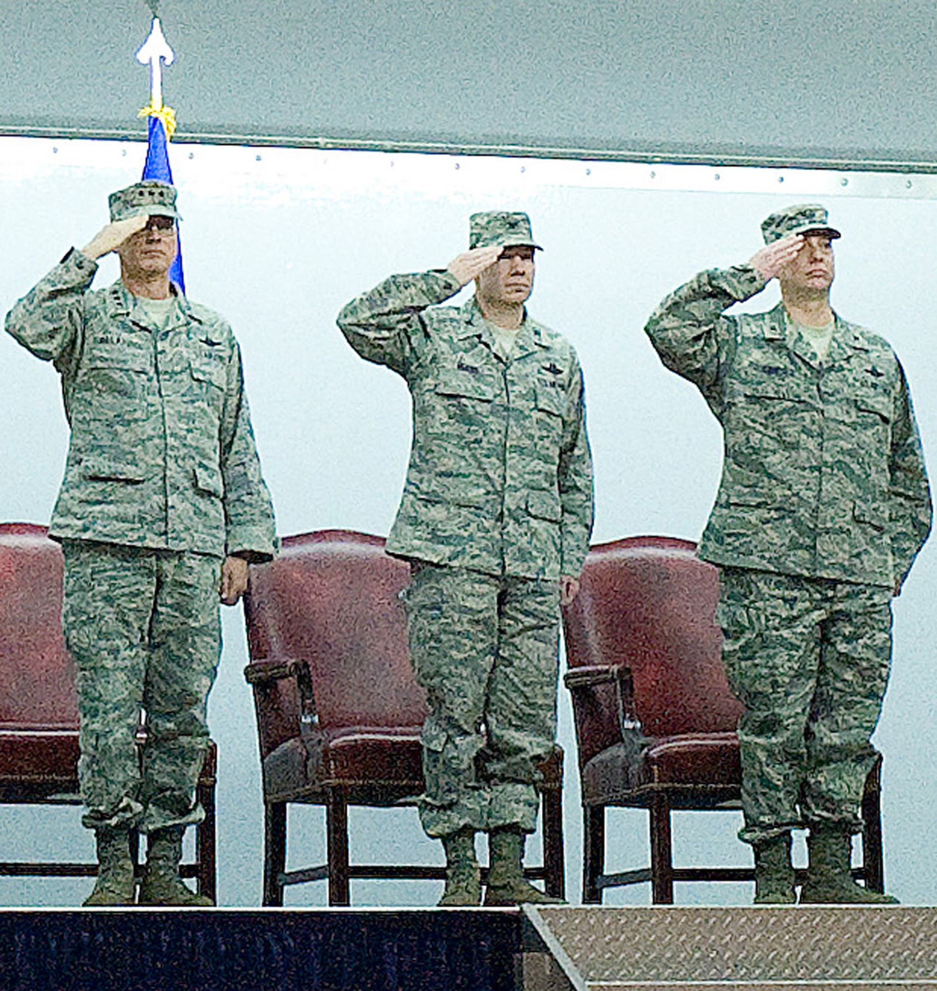 Lt. Gen. Robert Allardice (left), 18th Air Force commander, Col. Manson Morris and Col. Mark Camerer salute the colors during the 436th Airlift Wing change of command ceremony Jan. 27, 2011.  (U.S. Air Force photo/Jason Minto)