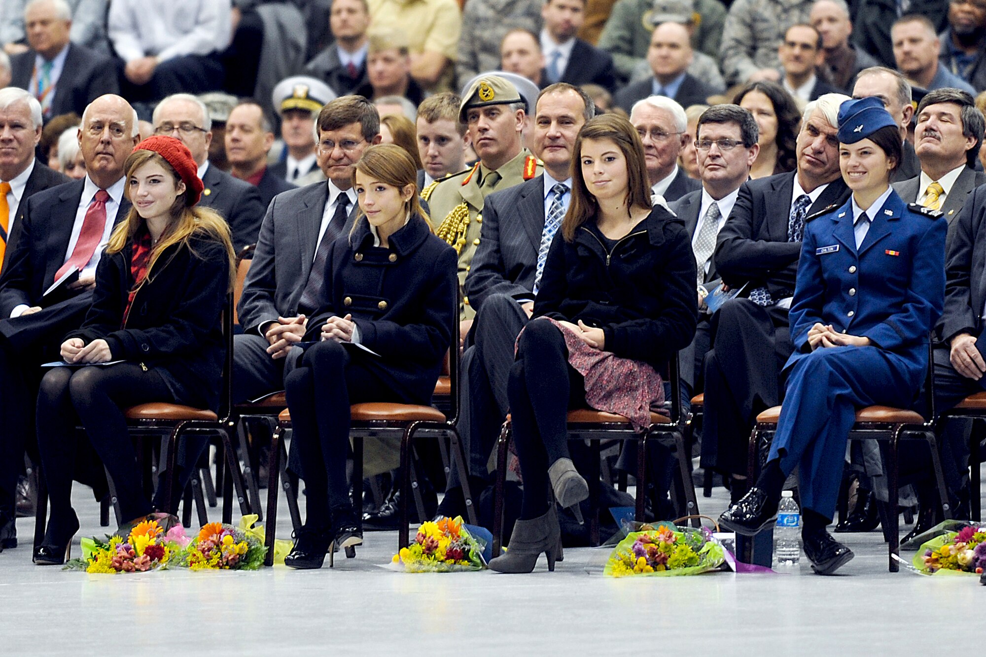 The four daughters of Gen. Kevin P. Chilton, outgoing commander of U.S. Strategic Command, smile as he thanks them for their "involuntary service" during his career.  General Chilton made the remarks during the change-of-command ceremony Jan. 28, 2011, at Offutt Air Force Base, Neb. Gen. C. Robert Kehler assumed command during the ceremony. (Defense Department photo/Cherie Cullen)