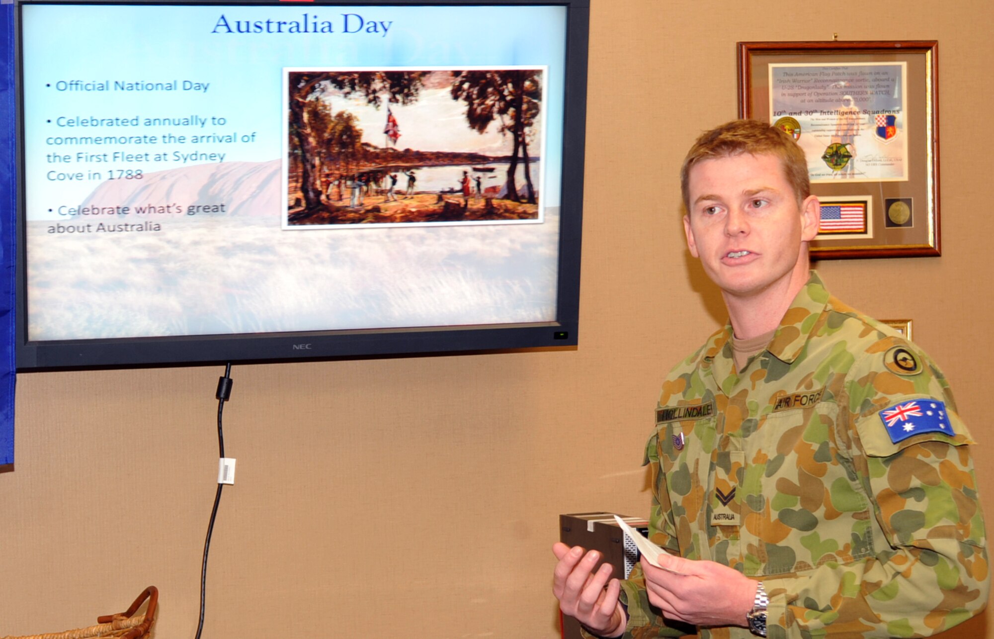 Cpl. Craig Hollindale, Royal Australian Air Force, talks to the men and women of the 480th Intelligence, Surveillance and Reconnaissance Wing, Langley Air Force Base, Va., about the history and importance of “Australia Day”, the official national holiday of Australia.  Corporal Hollindale is attached to the 497th ISR Group as part of an orientation program. (U. S. Air Force photo/Staff Sgt. Logan Tuttle) 