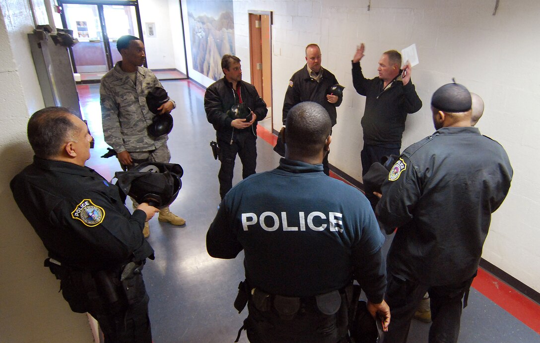 An Instructor briefs his opposing force on how to start off the scenario during the Basic Active Shooter Course, Jan 27.  Members from the 610th Security Forces Squadron, Joint Reserve Base Fort Worth, Texas, came to Dobbins Air Reserve Base to provide critical training for the 94th Security Forces Squadron and other Dobbins area security personnel.  The two day course provides classroom and tactical instruction to first responders covering several shooting spree scenarios.   (U.S. Air Force photo/ Brad Fallin)