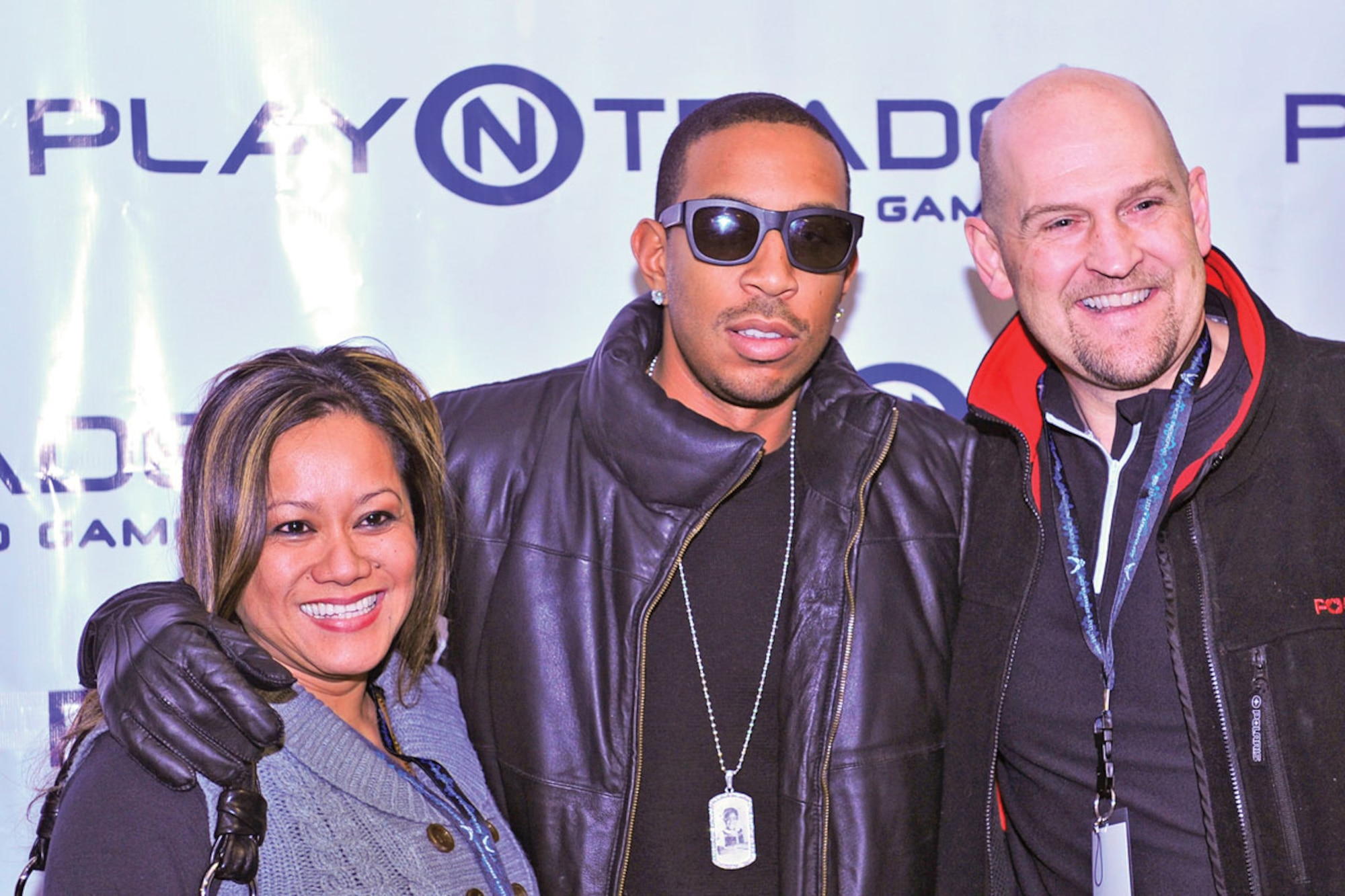 Air Force Maj. Gina Gorski, 477th Aerospace Medical Flight, meets with Chris “Ludacris” Bridges before his concert Jan. 20. She was awarded the opportunity as part of the Get One Now Program where she recently referred 24 men and women to sign up for the Air Force Reserve. (U.S. Air Force photo/Senior Airman Kristin High)