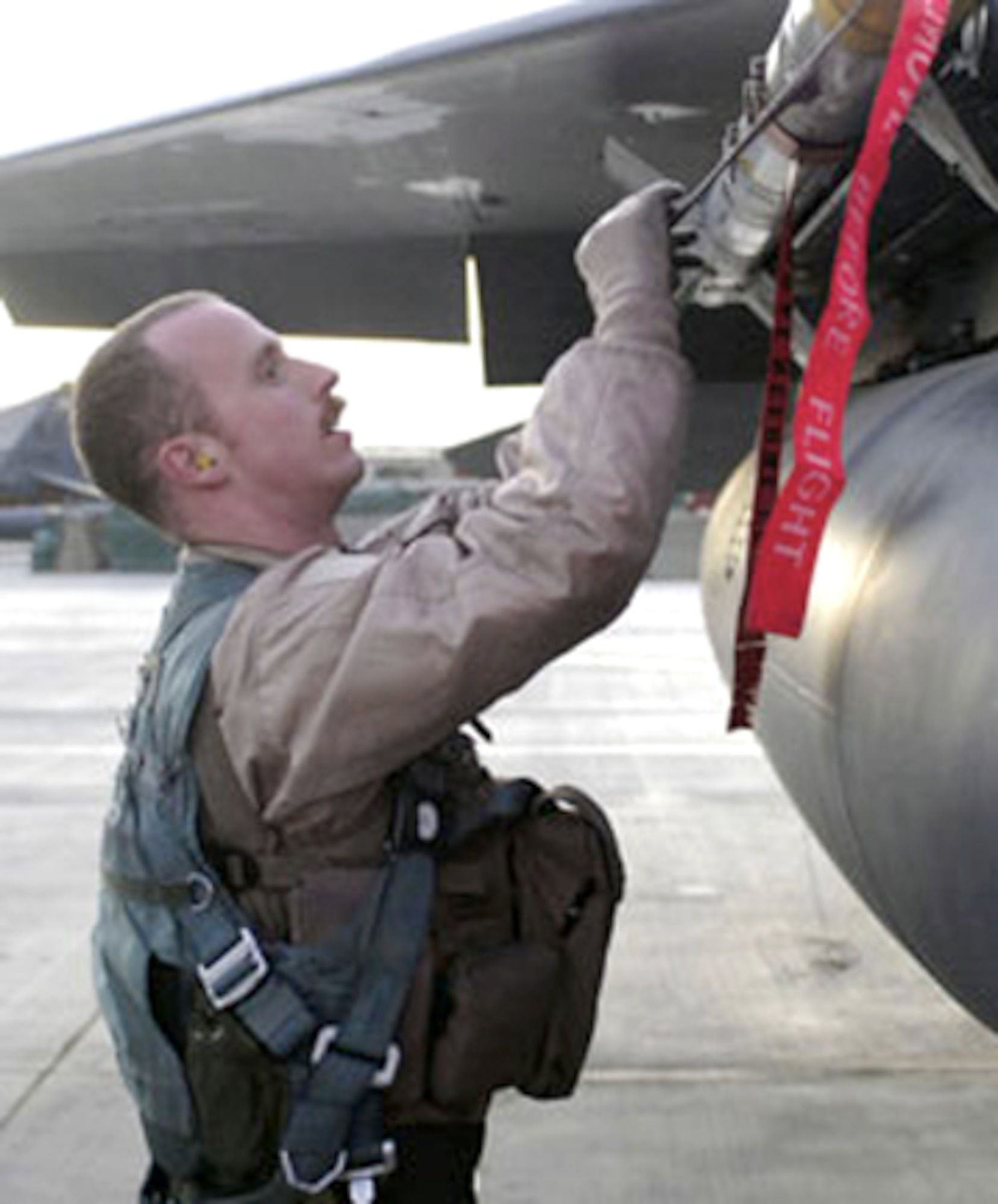 Capt. Michael Polidor conducts a pre-flight inspection on an F-15E Strike Eagle Nov. 24, 2009, at Bagram Airfield, Afghanistan. Captain Polidor, a 2004 Air Force Academy graduate, was selected to receive the Col. James Jabara Airmanship Award by the Academy, the Association of Graduates and the Jabara family. (U.S. Air Force photo/Senior Airman Felicia Juenke)